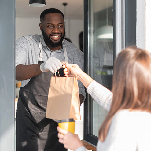 fast food restaurant service, handing food to customer