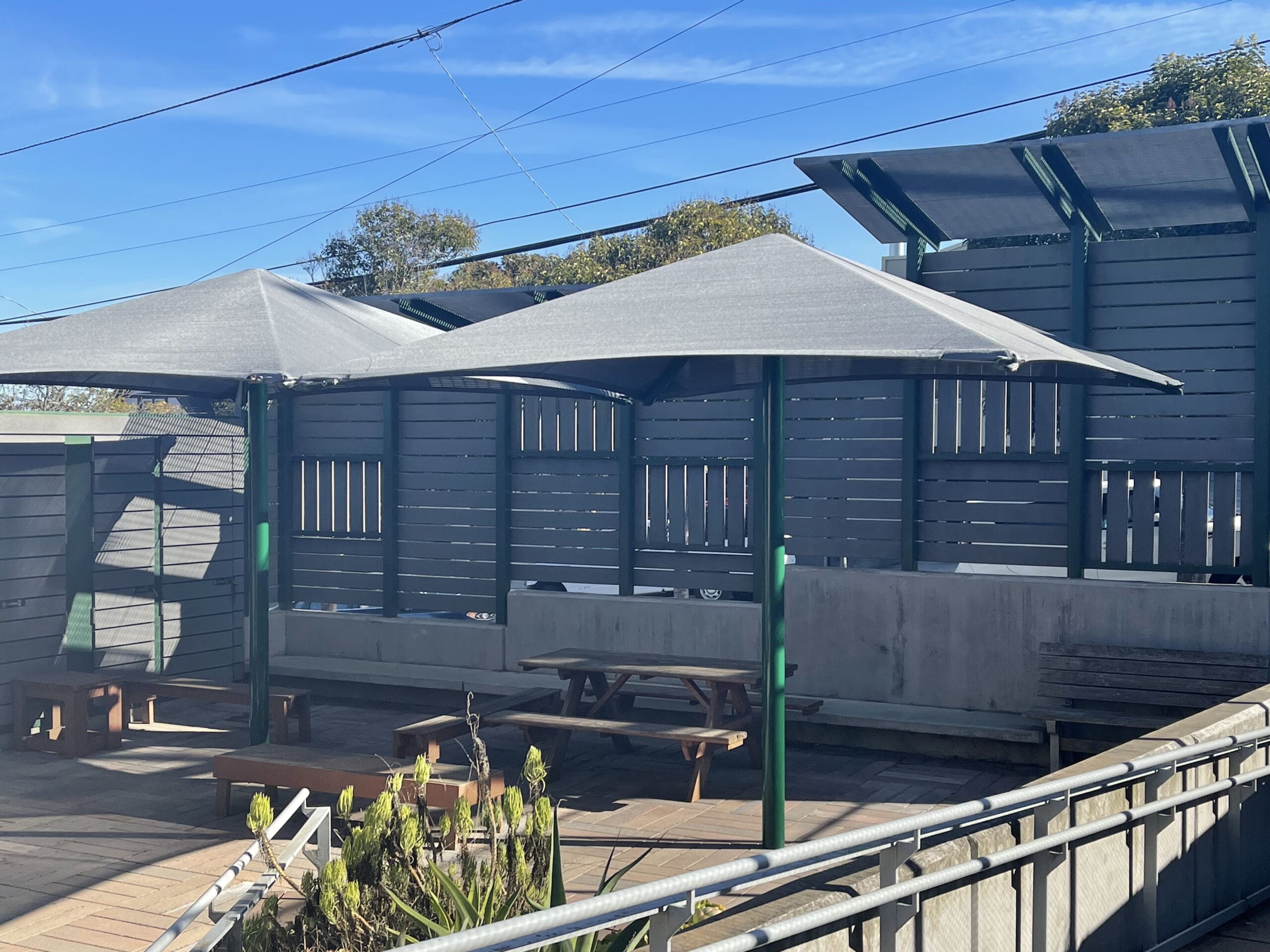 grey shades covering picnic tables