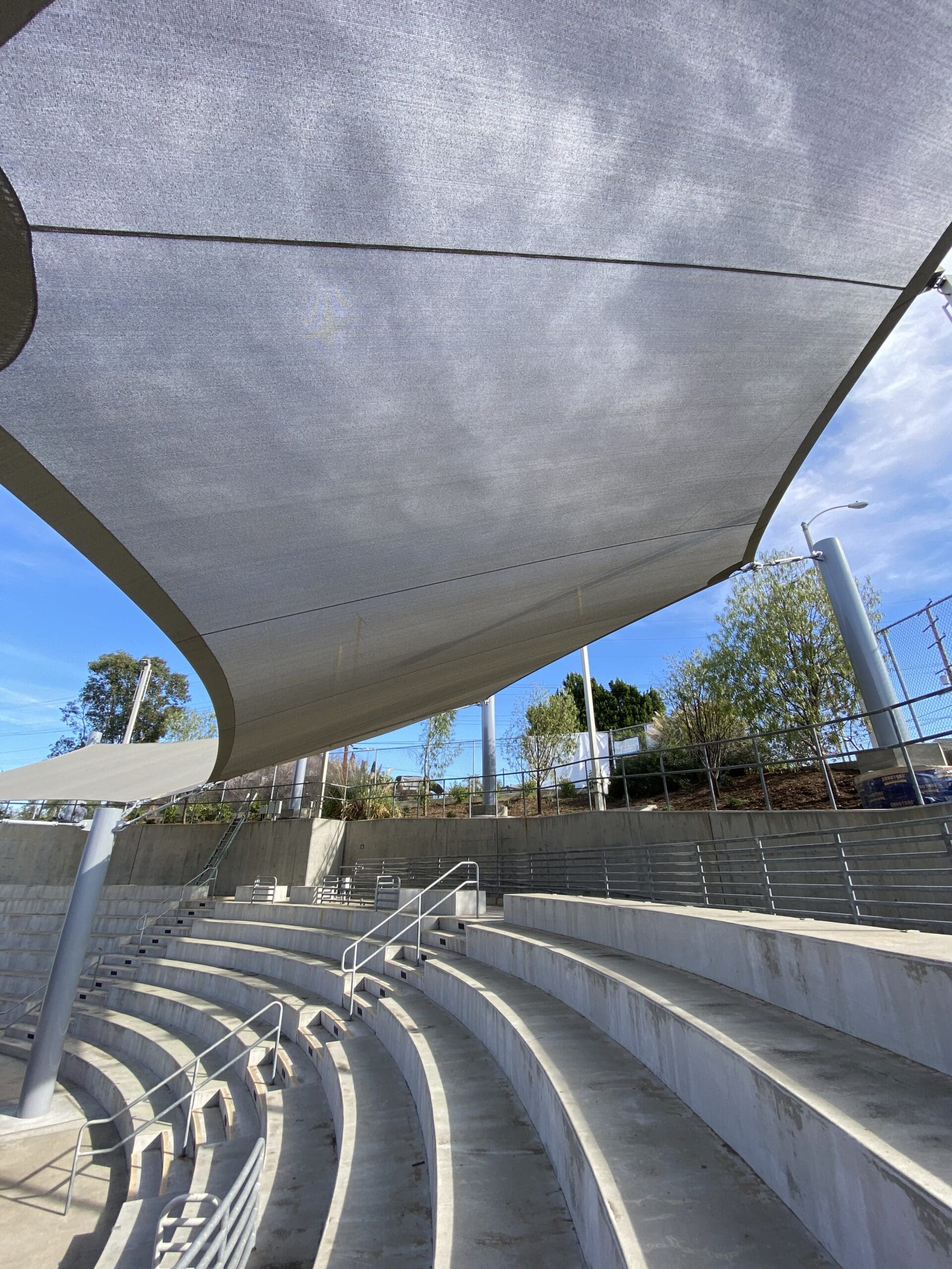 concrete amphitheater seating under shade
