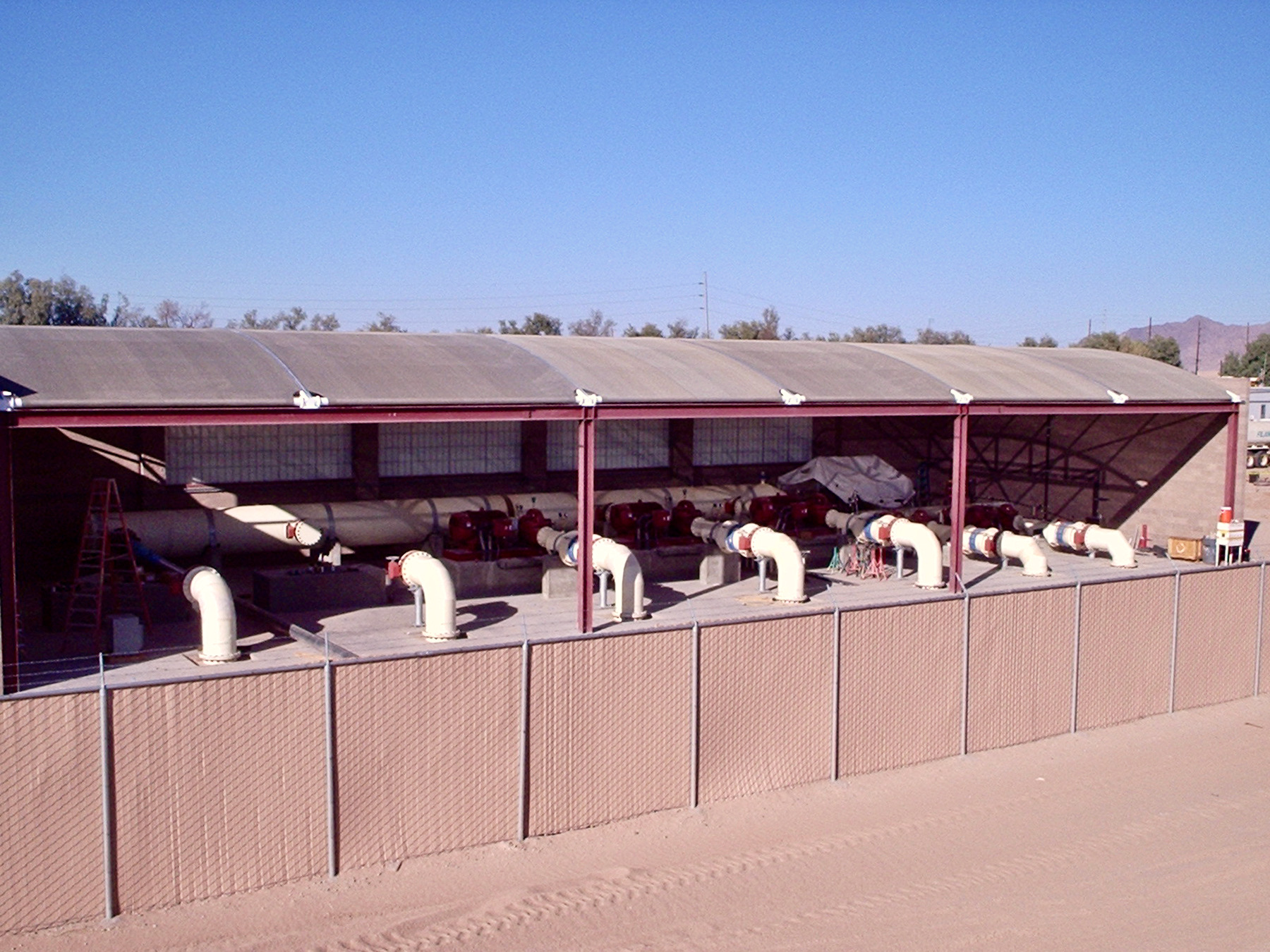 water treatment facility next to dirt lot