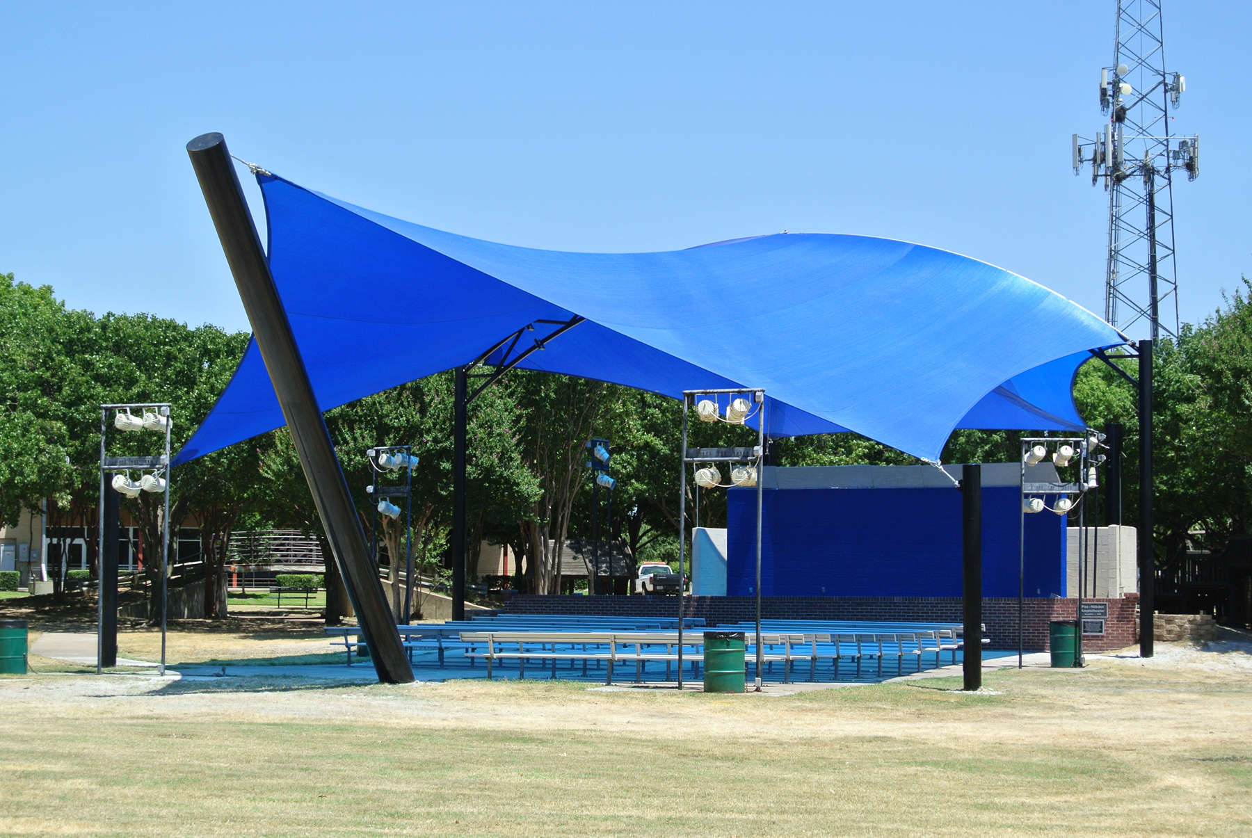 outdoor event space with blue shade cover