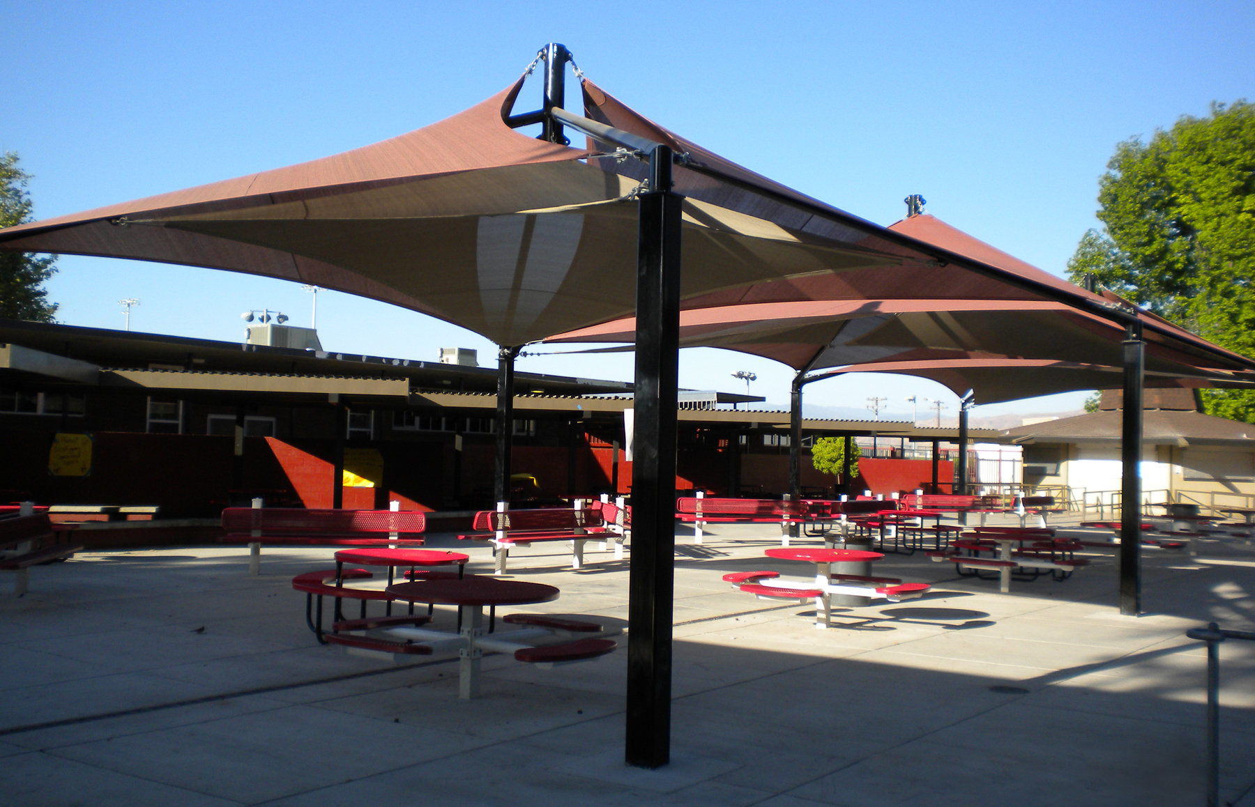 shade structure protects outdoor eating area
