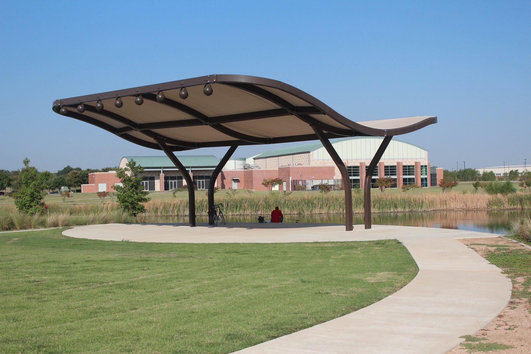 shade next to pond and grass field