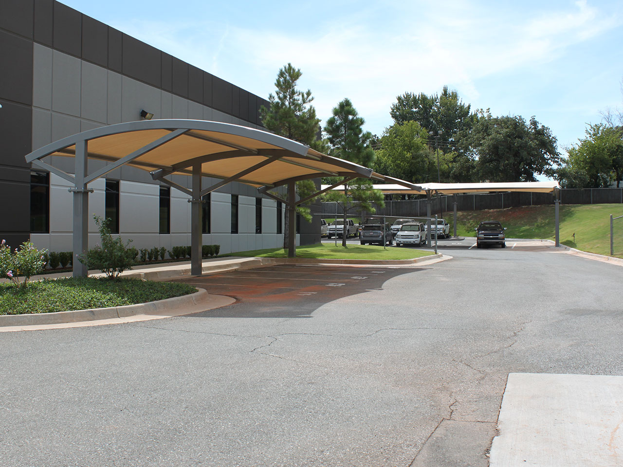 shades covering outdoor parking area