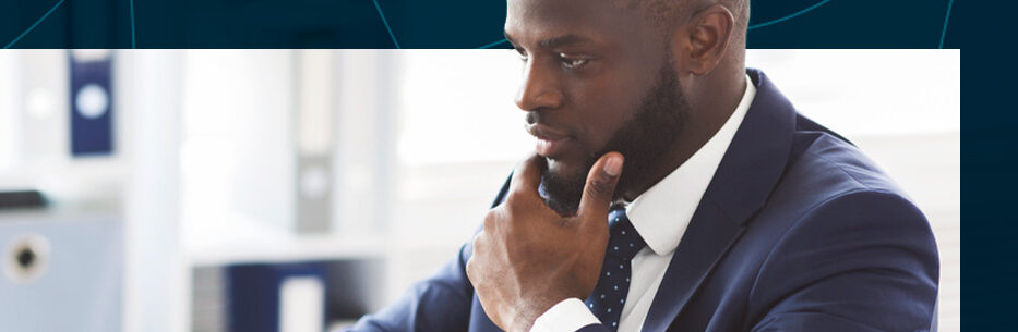 Arizona businessman considering business designs on laptop