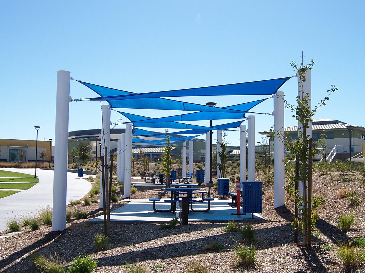 white and blue shade structure covering outdoor seating