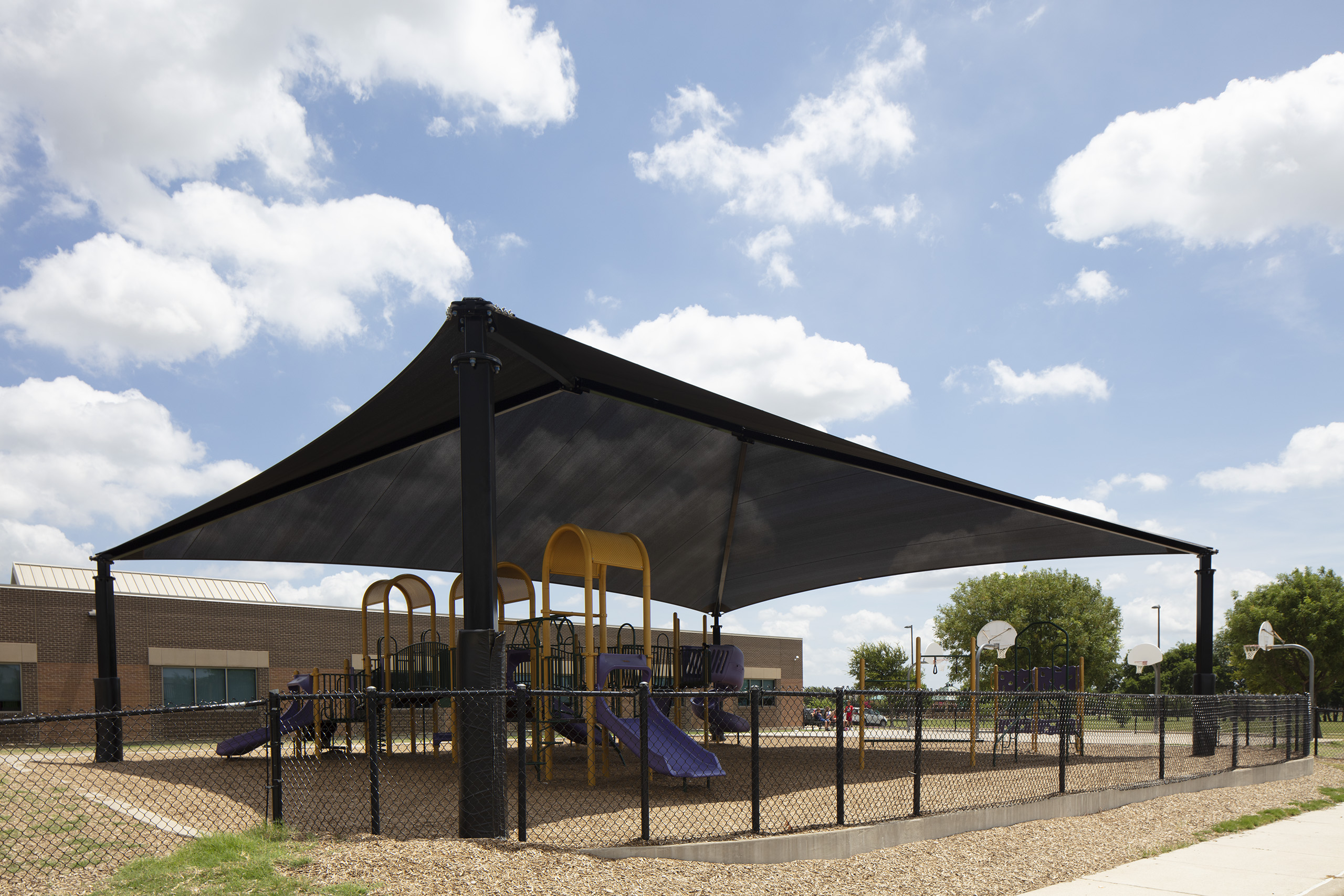 school playground covered by black shade