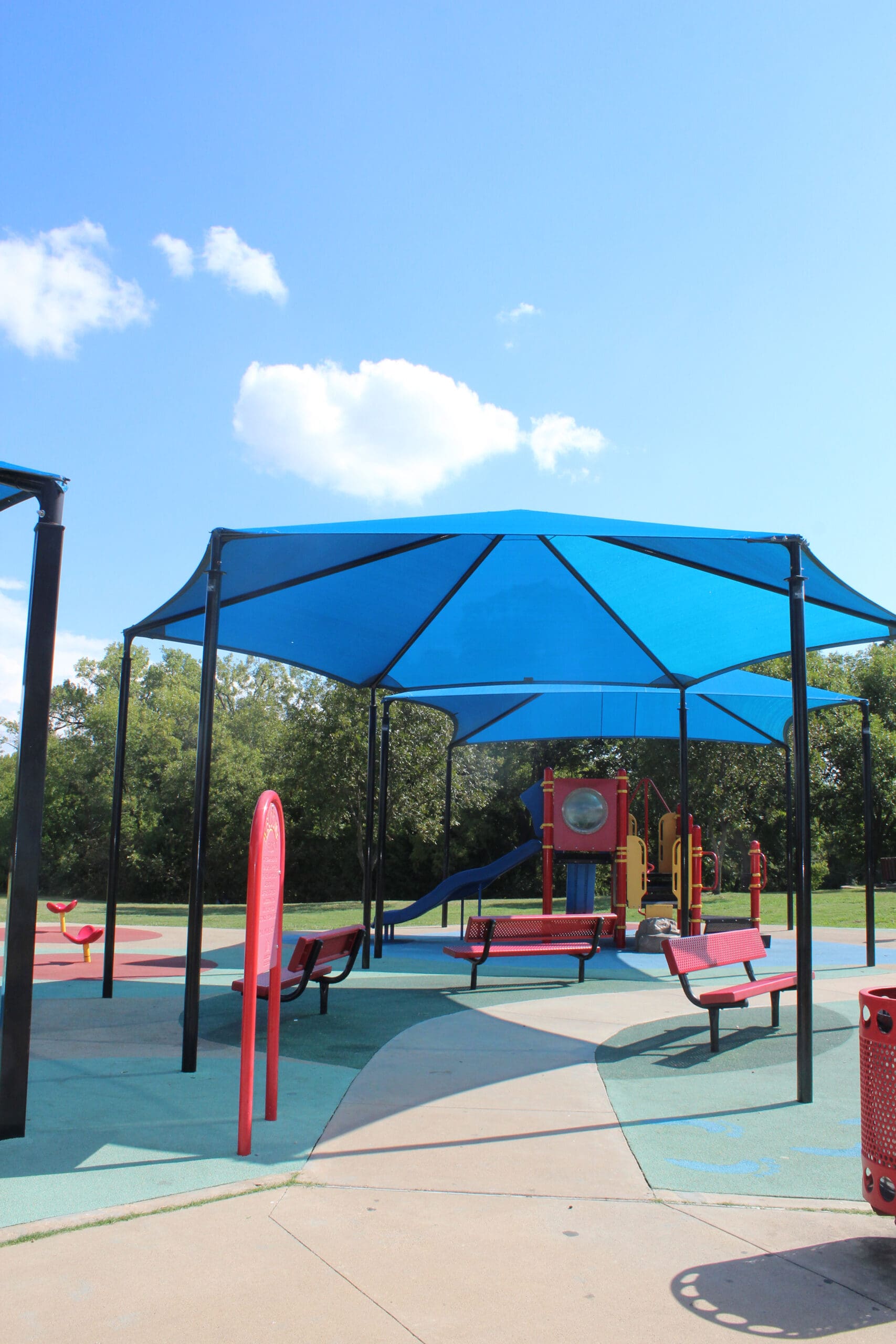 blue usa shades covering playground benches