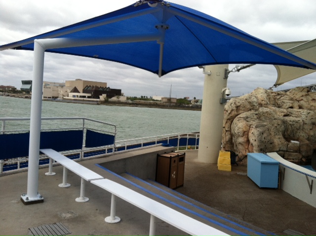 blue sun shade covering concrete bleachers