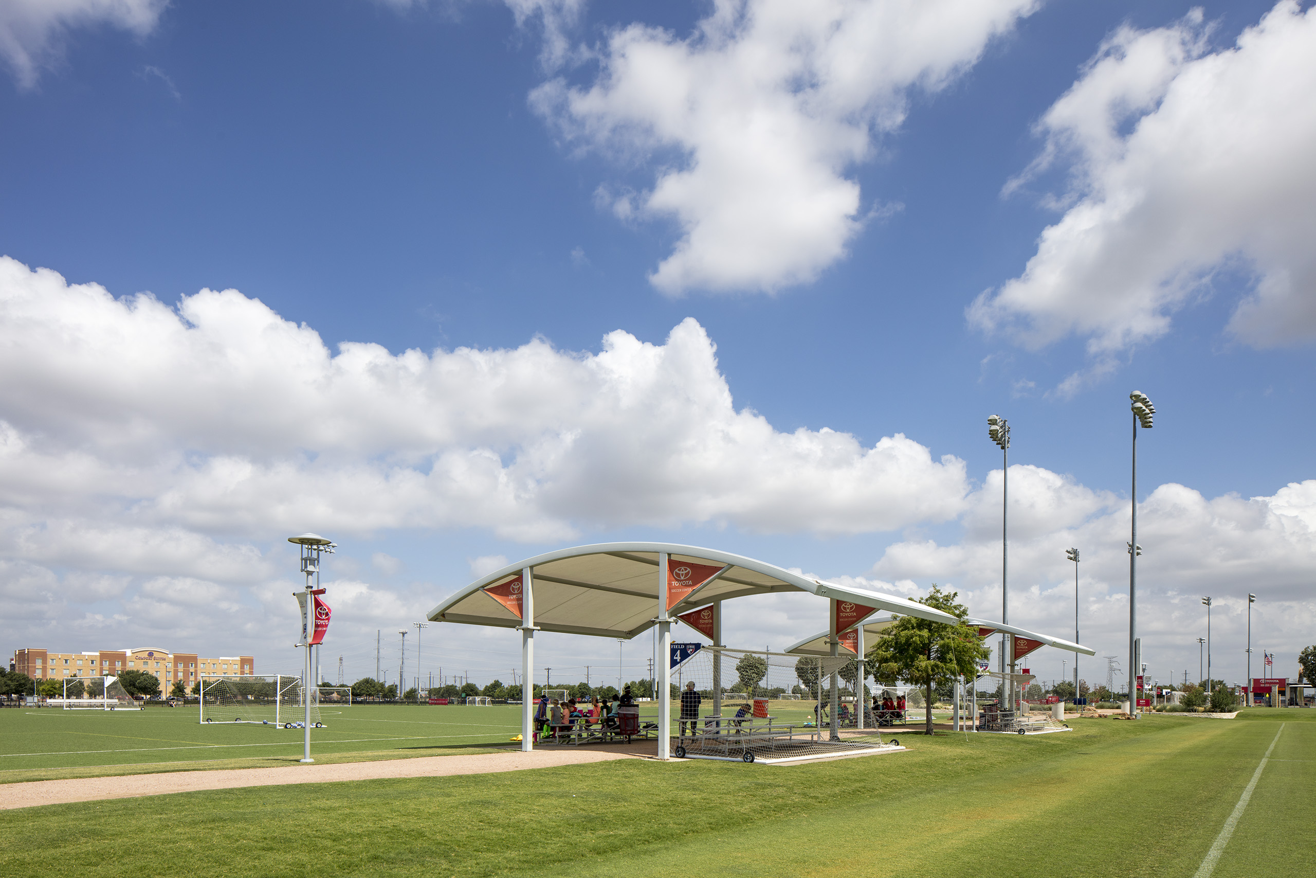 soccer field with usa shades covering seating area