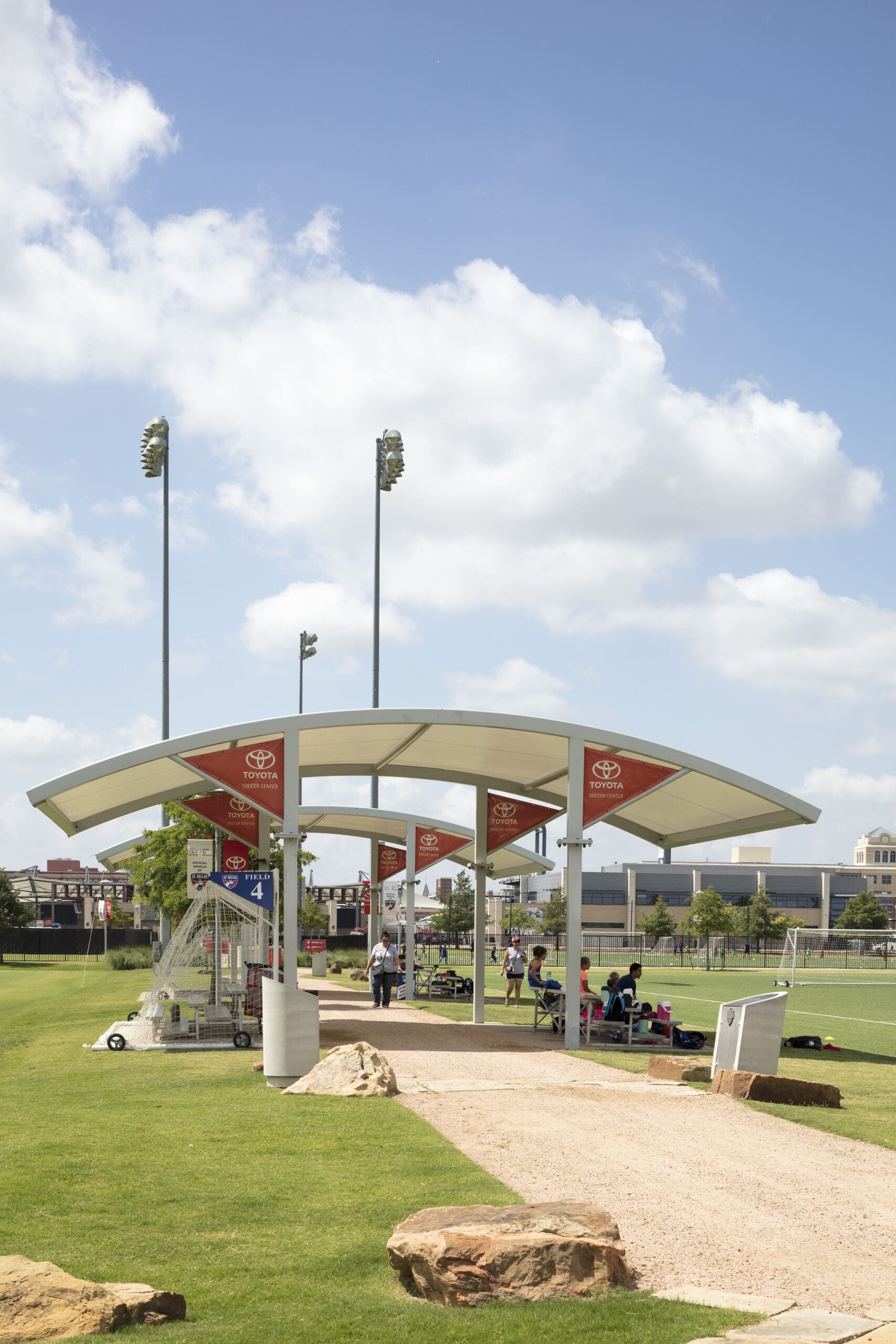 white usa shade structure next to soccer field