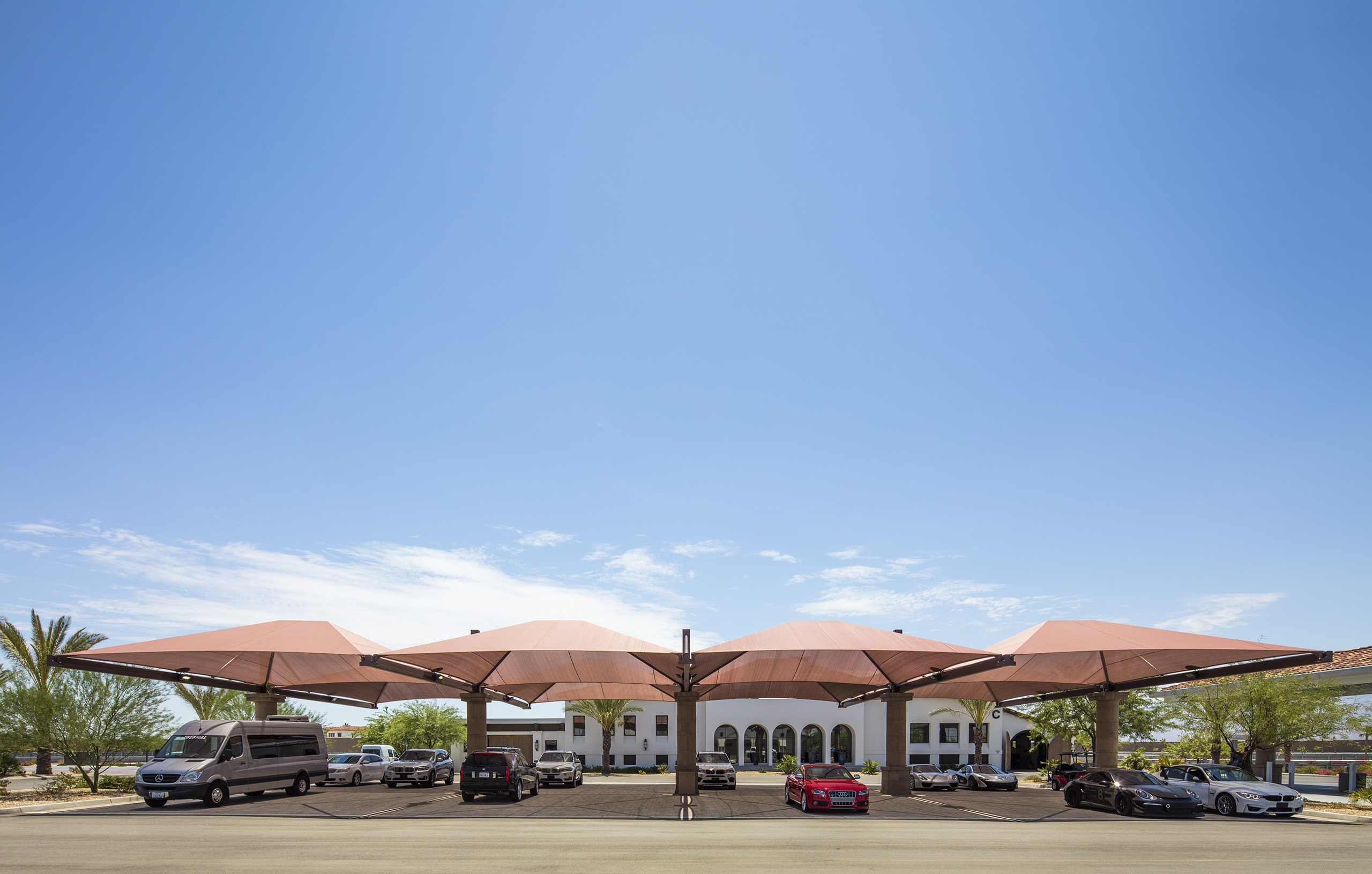 multiple usa shades covering multiple parked vehicles