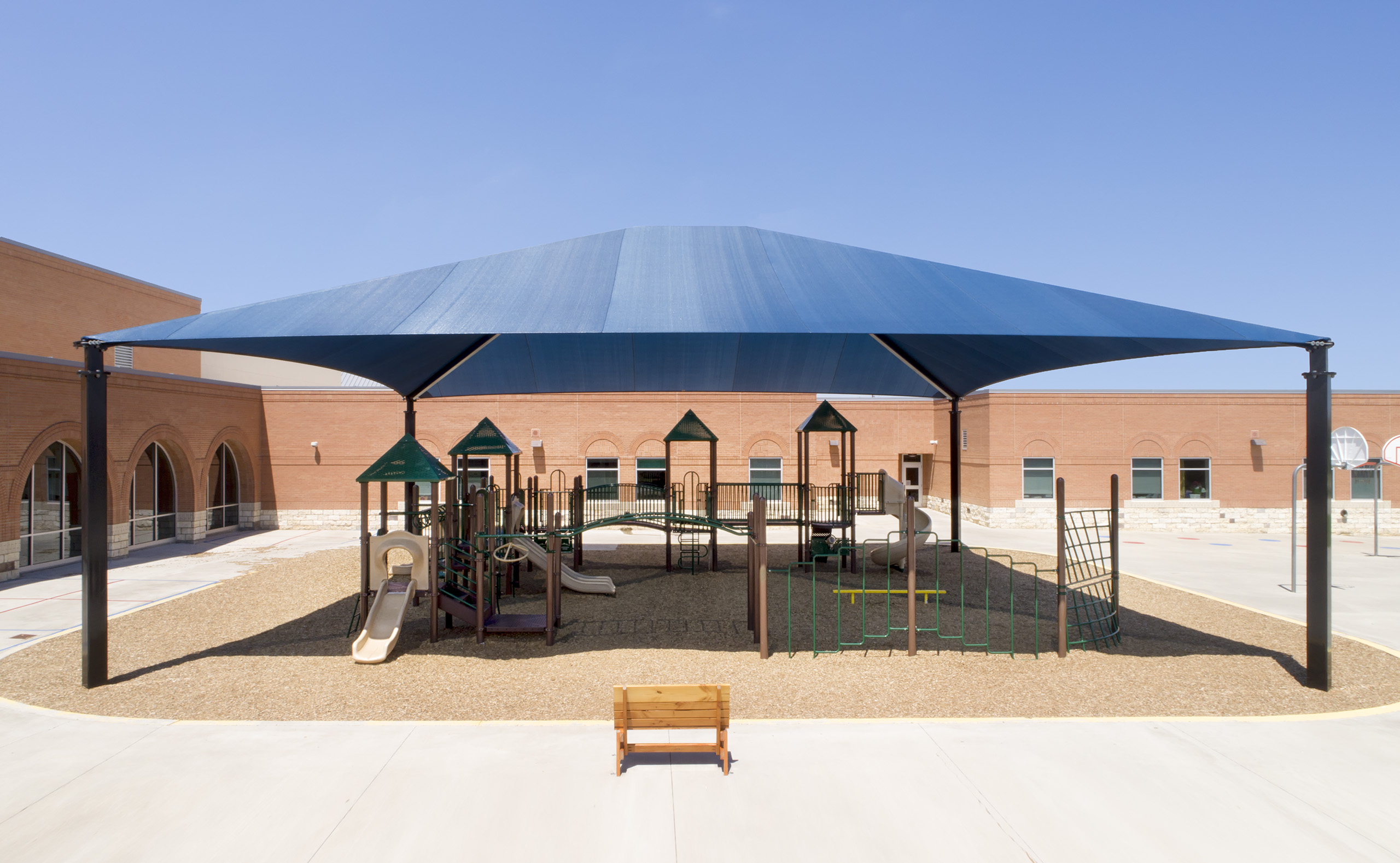 large school playground covered by shade