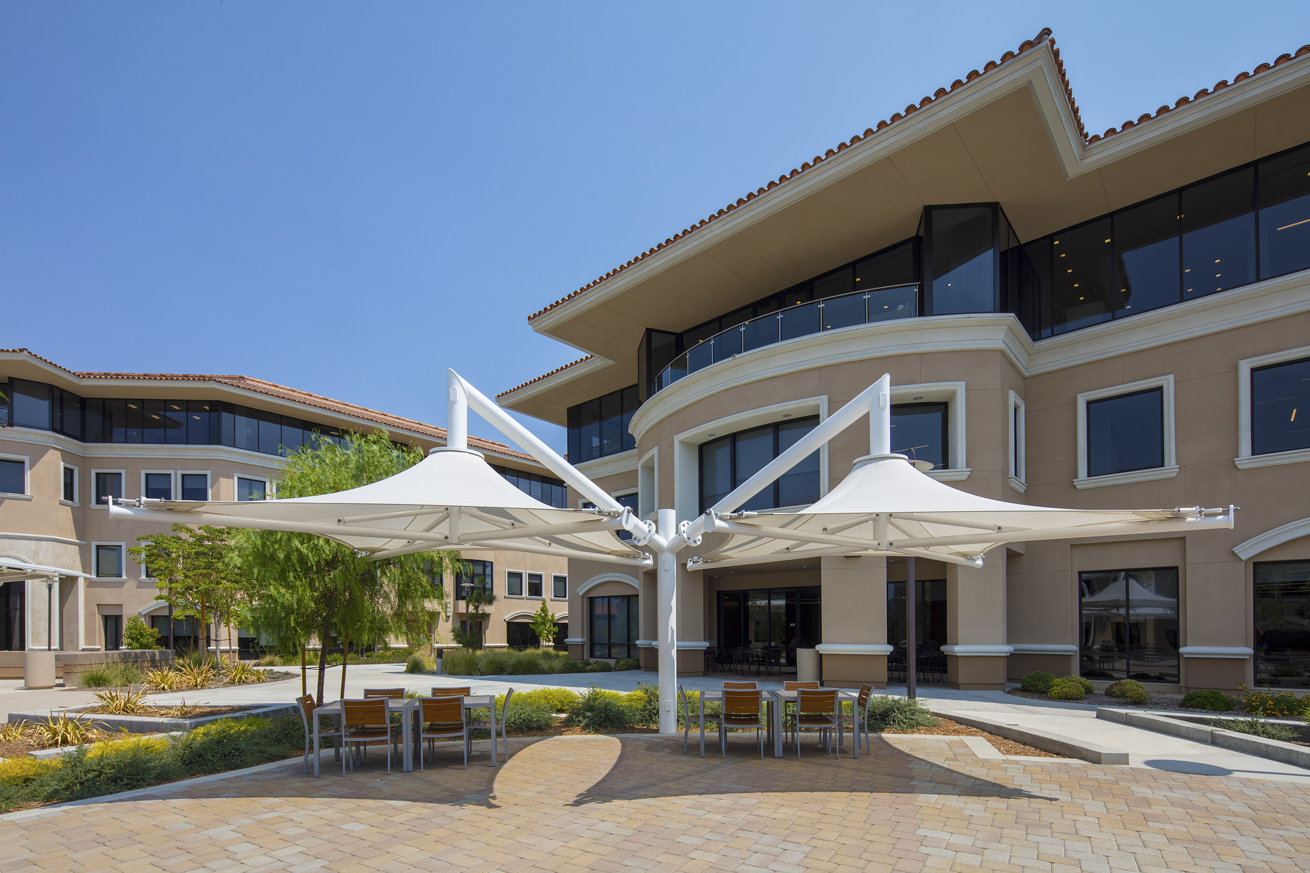 multiple shades covering outdoor dining area