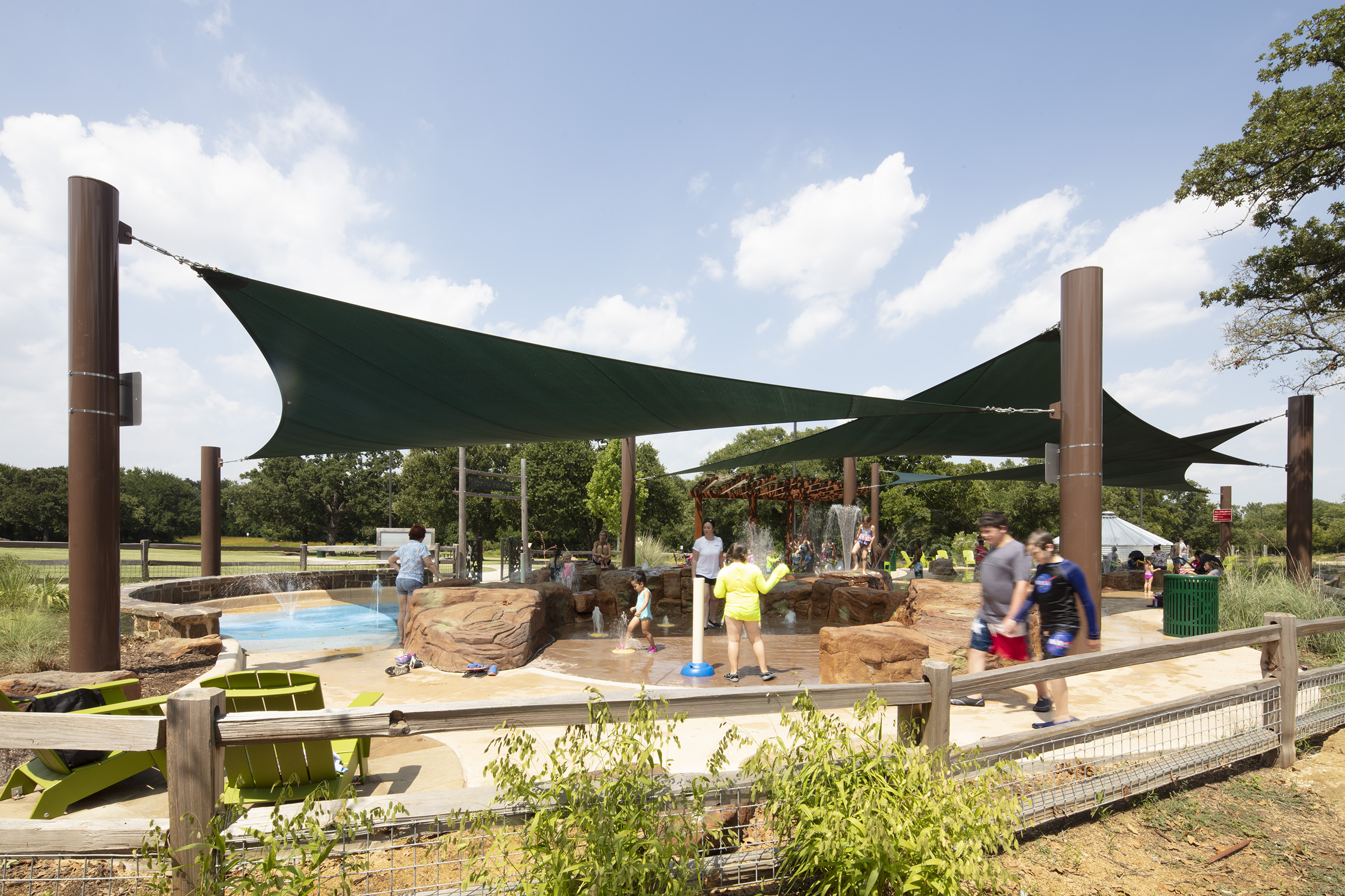 shade structure at water park play area splash pad