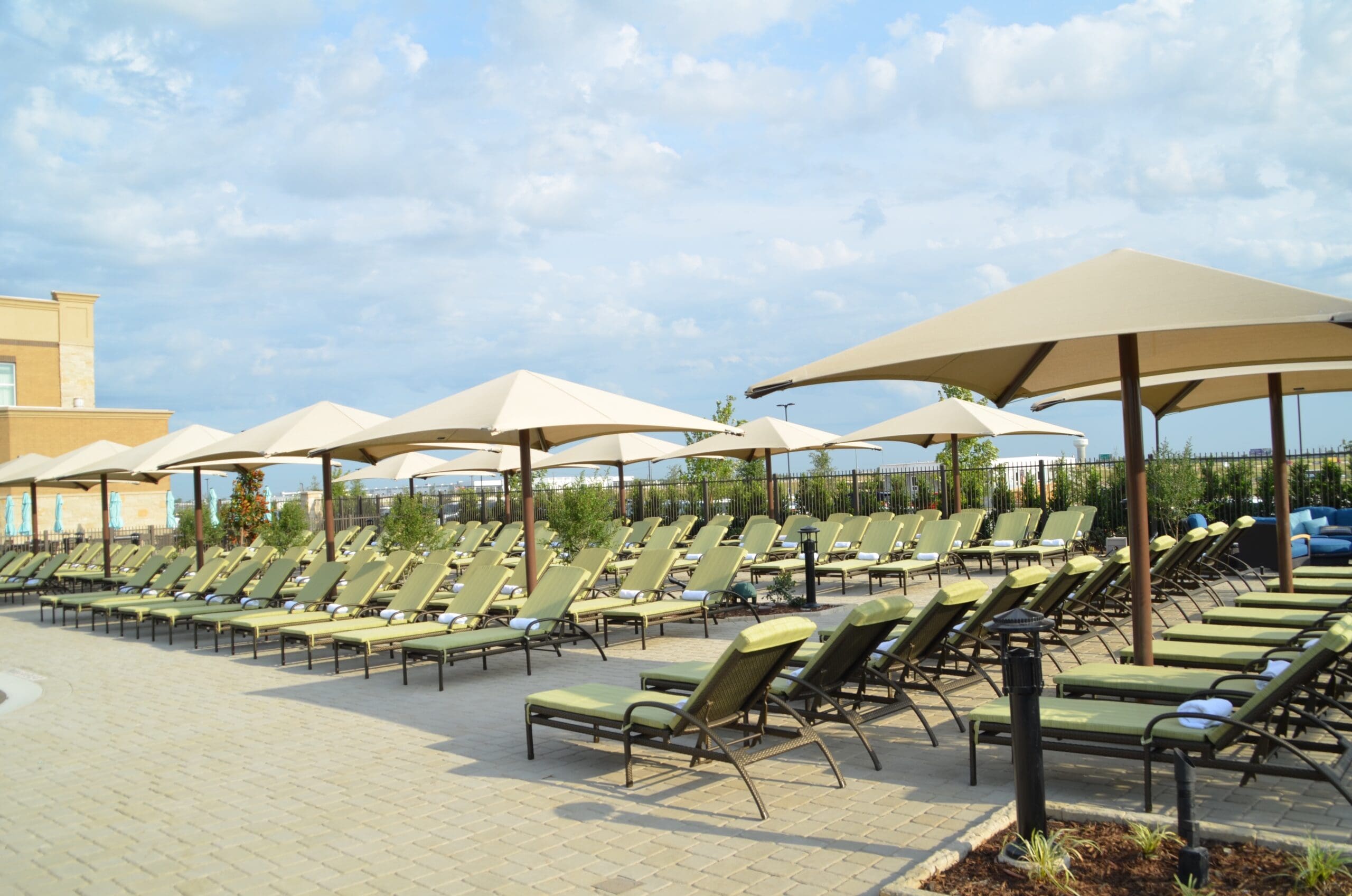 multiple sun shades covering multiple lounge chairs