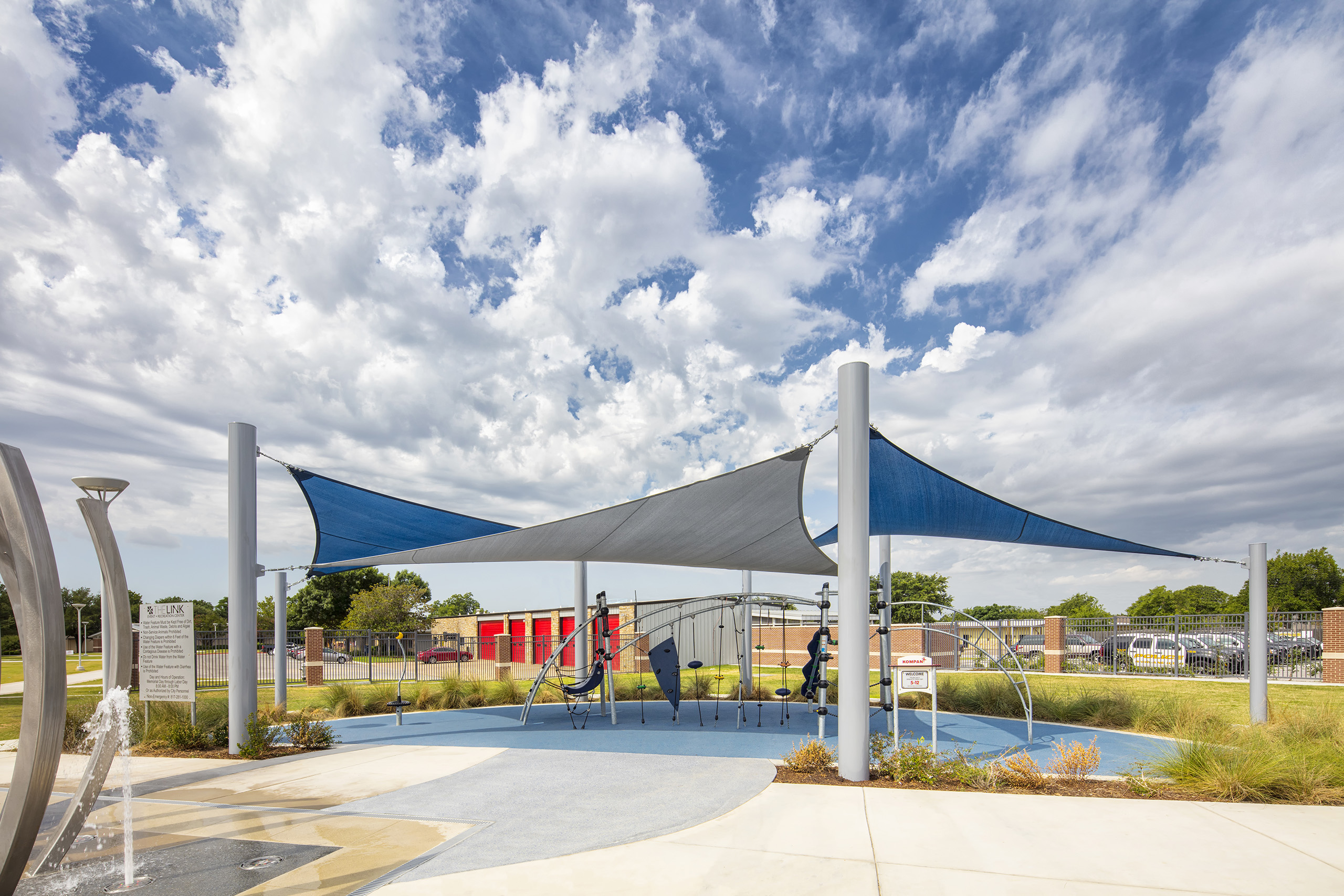 multiple triangle shades covering outdoor playground