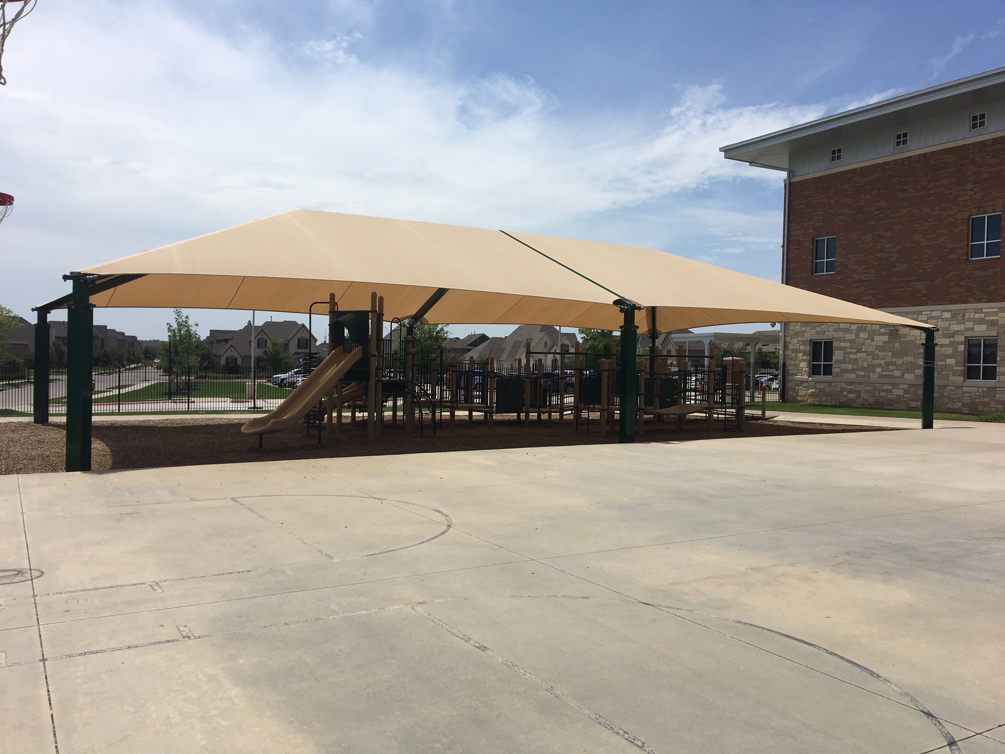 tan usa shade covering playground equipment