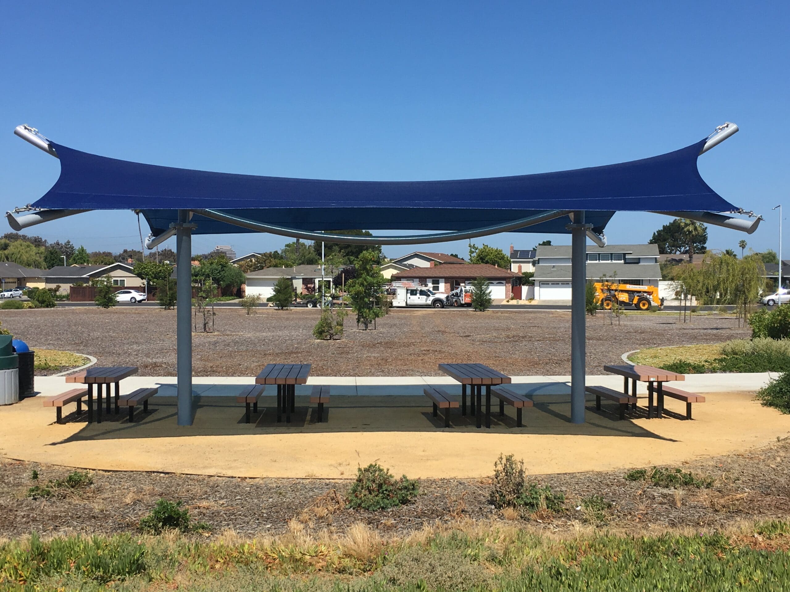 blue usa shade covering outdoor picnic tables