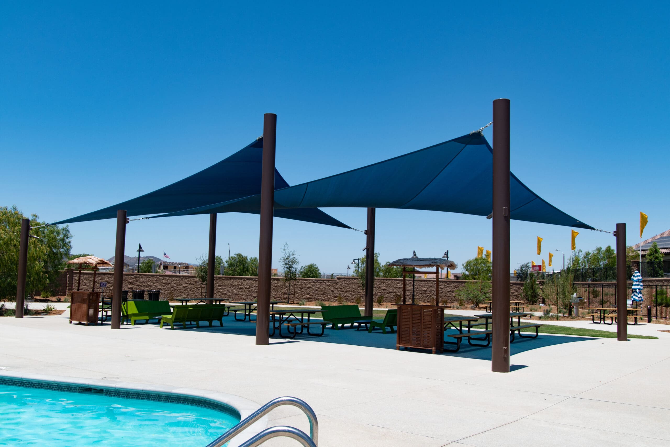 triangle shades over outdoor seating area