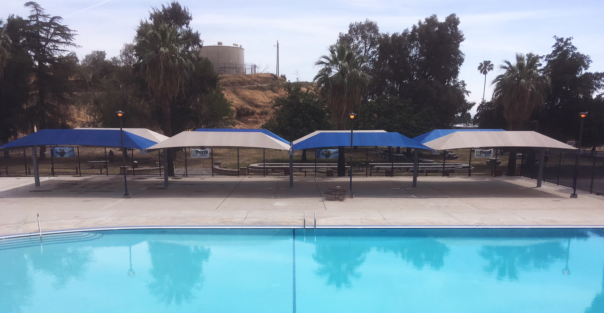 multiple shades next to outdoor pool