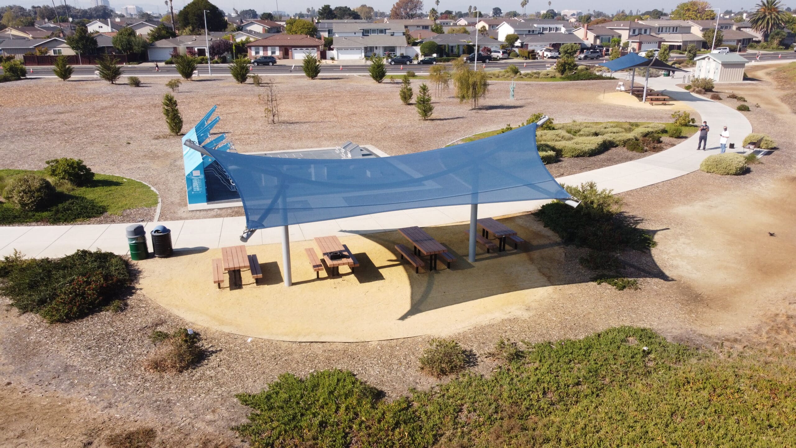 park picnic tables under usa shade structure