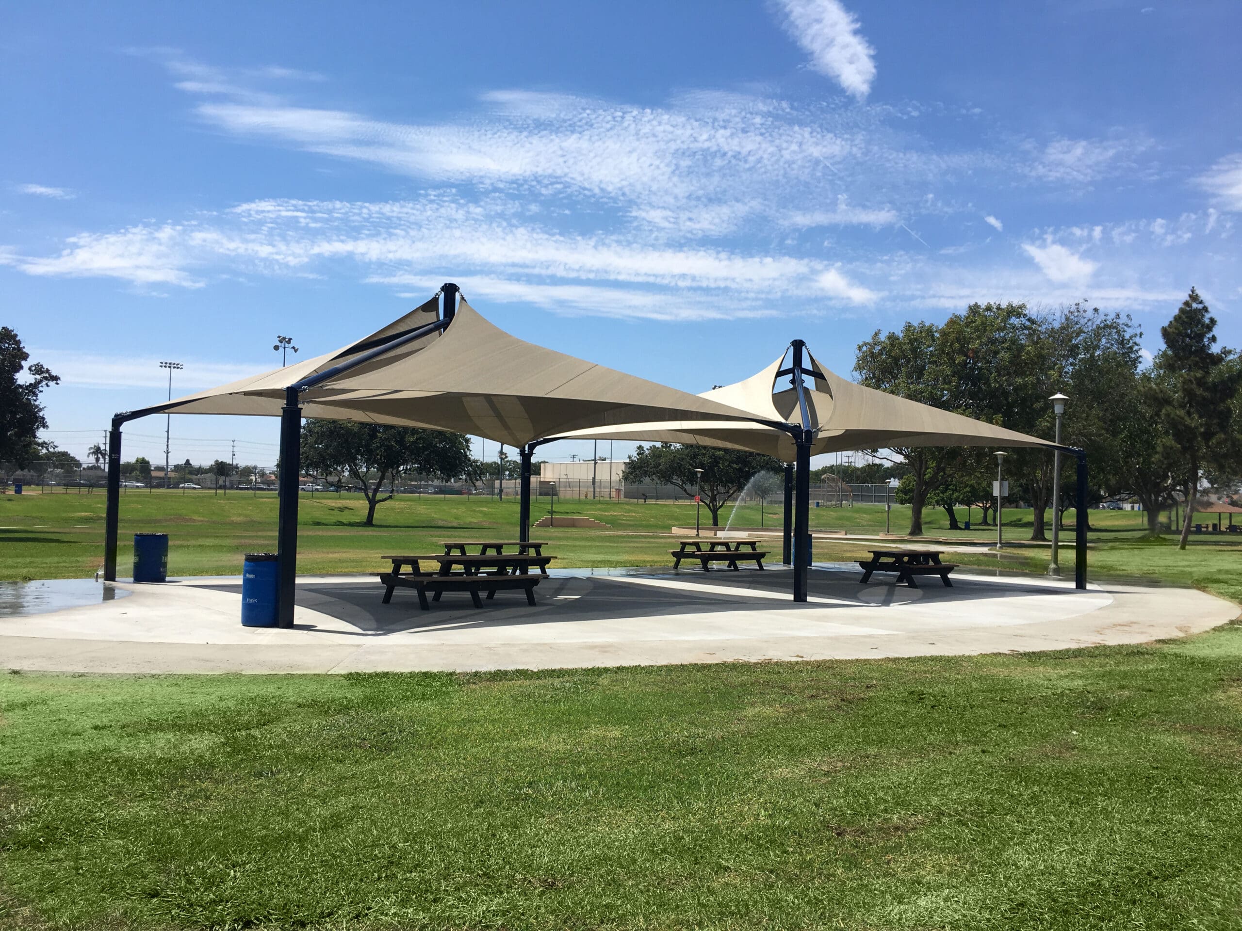 outdoor picnic tables covered by usa shadess