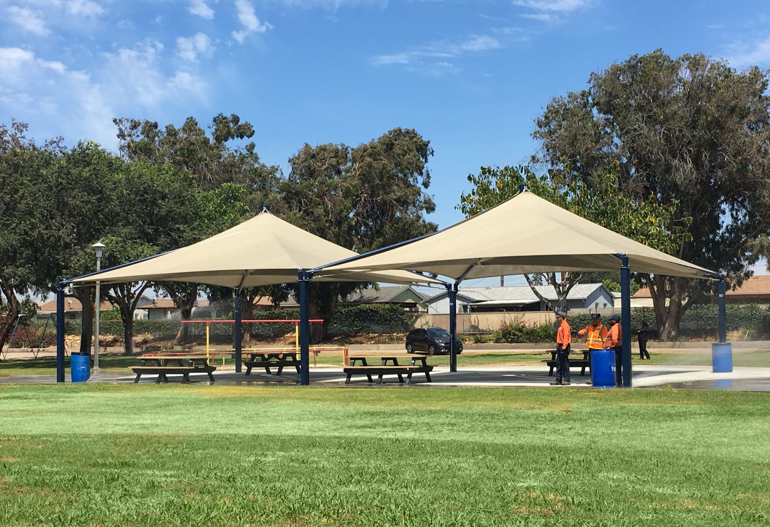 park picnic tables underneath tan usa shades