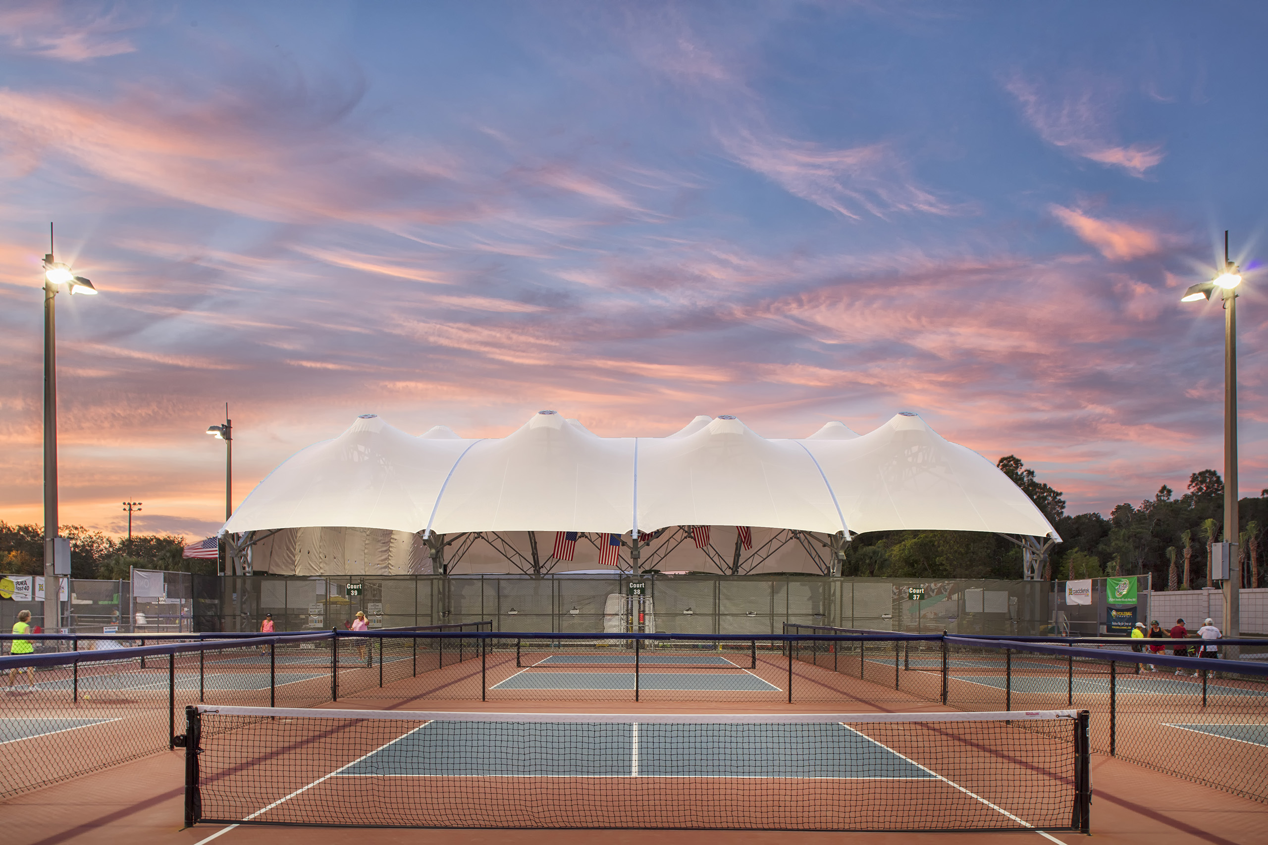 large sun shade covering tennis court