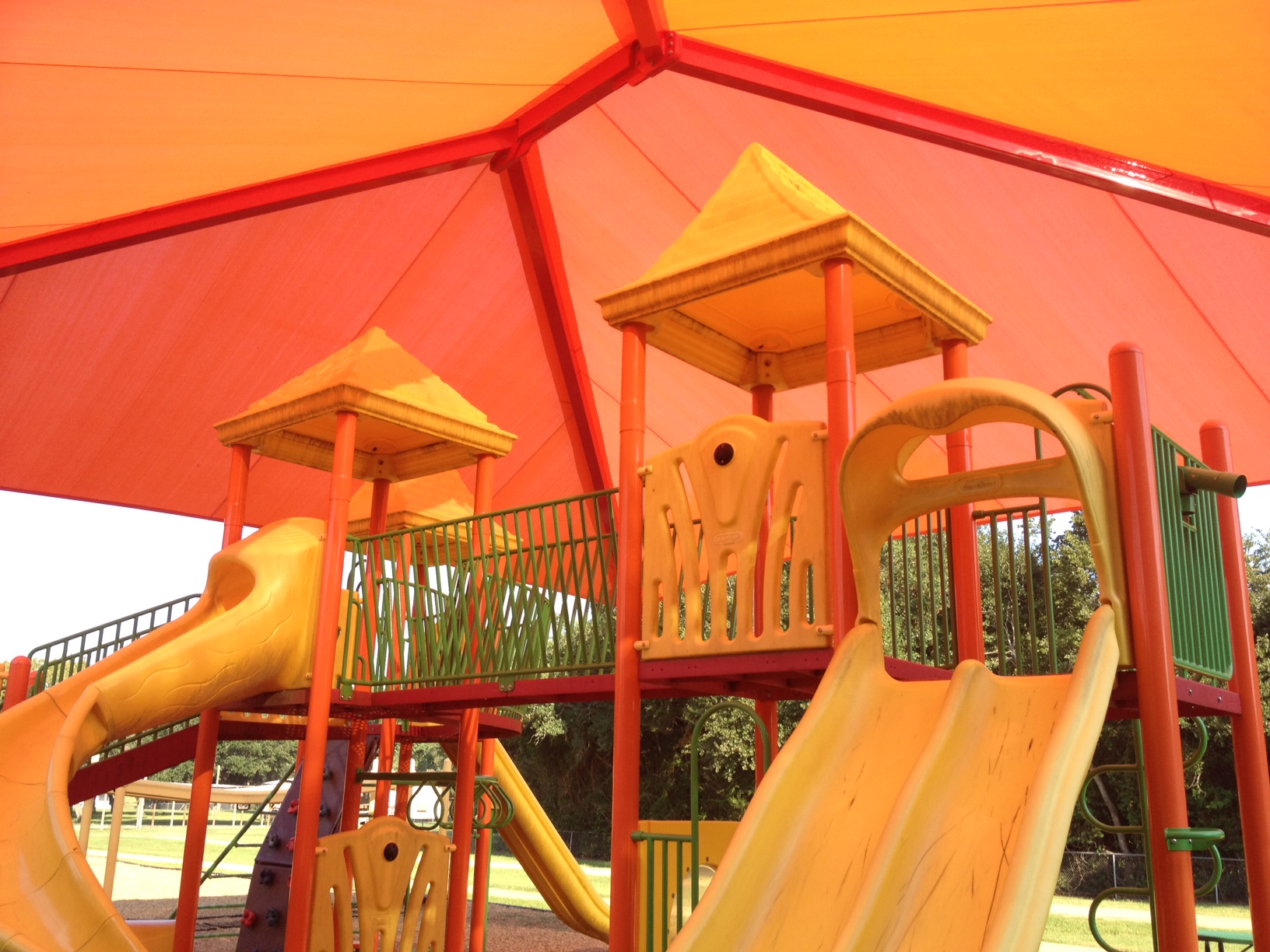Yellow playground under a USA Shade sun shade