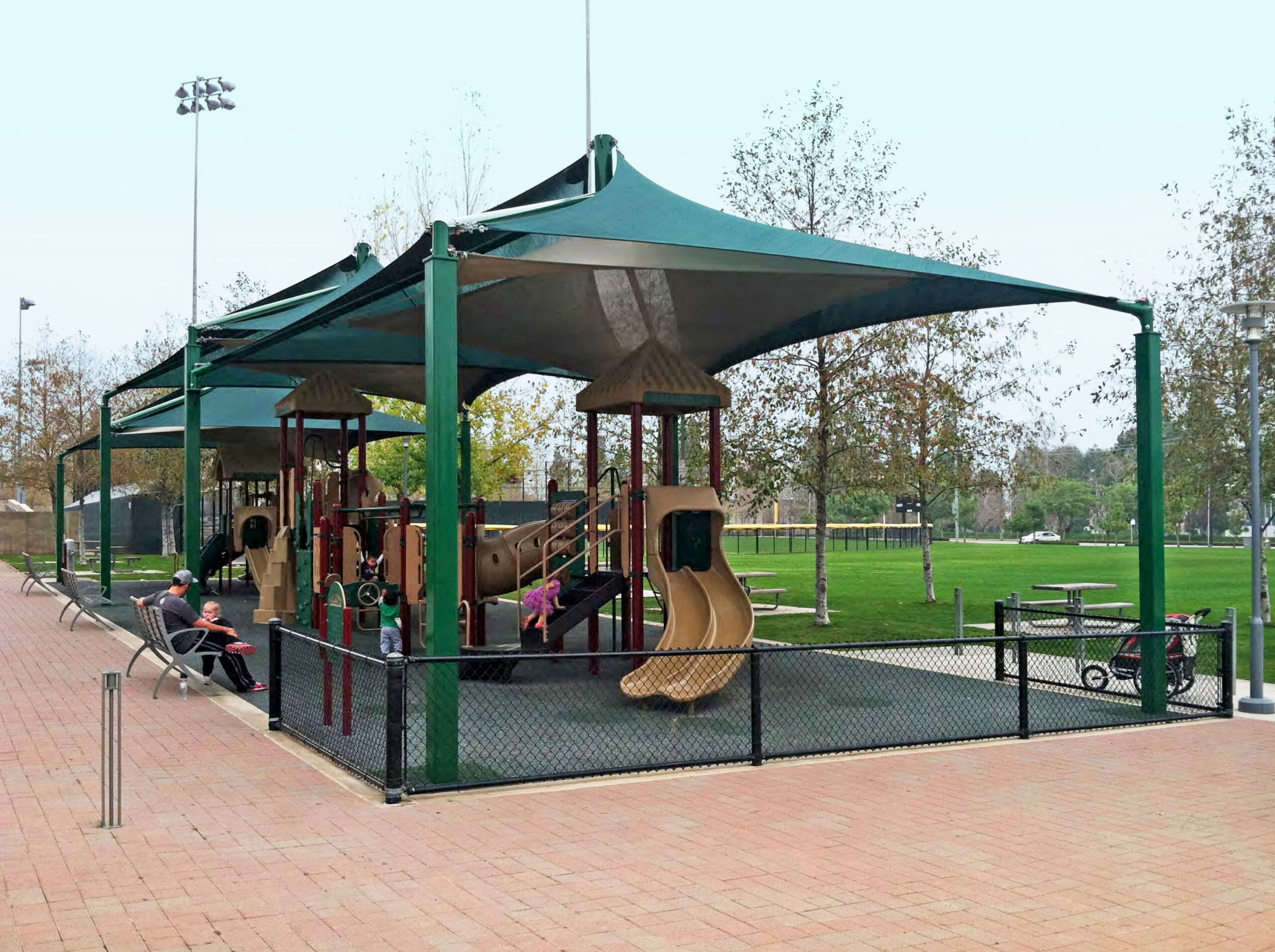 USA SHADE shade structures protecting a playground