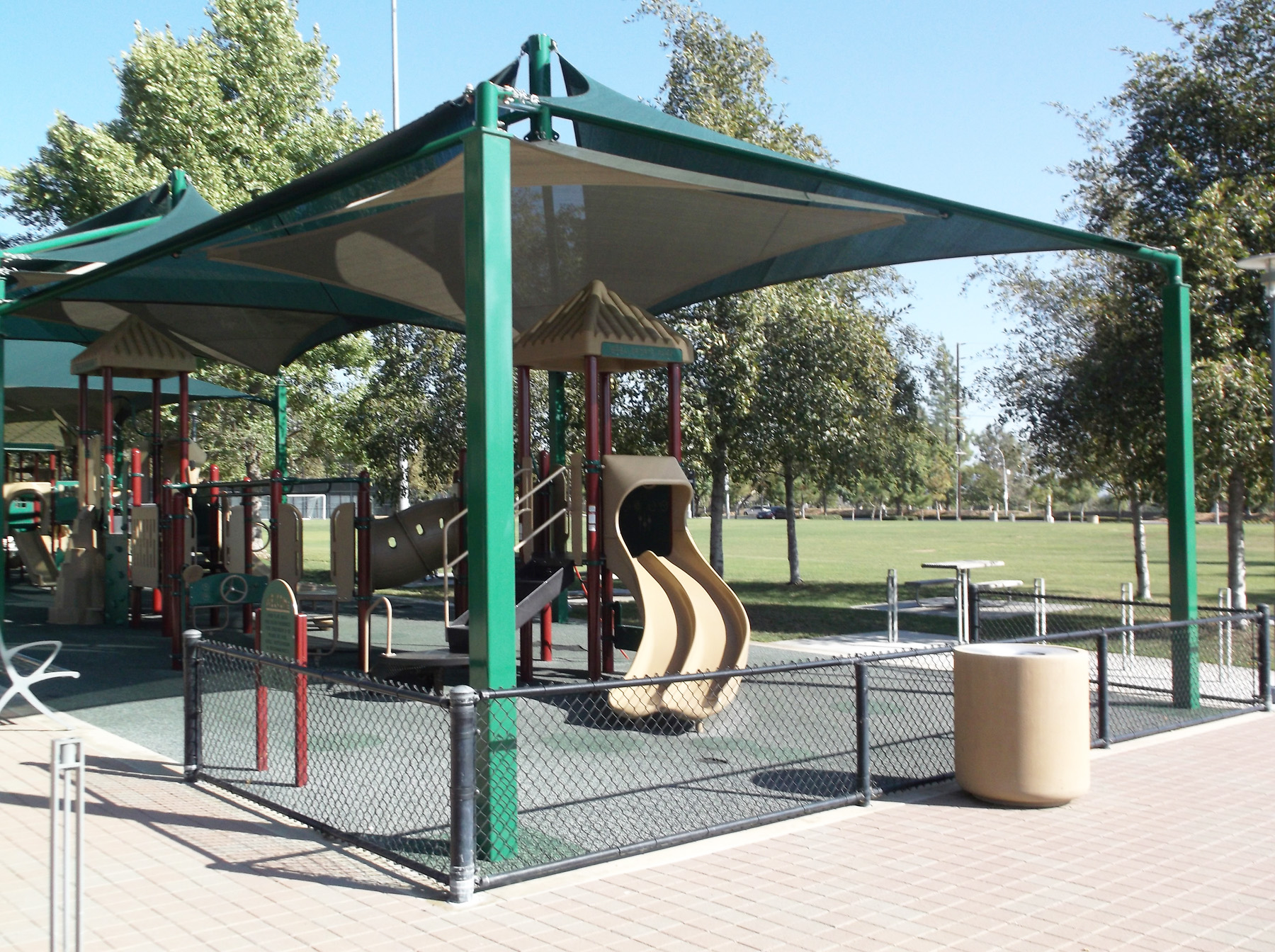 Shade Structures protect children for the sun at playgrounds