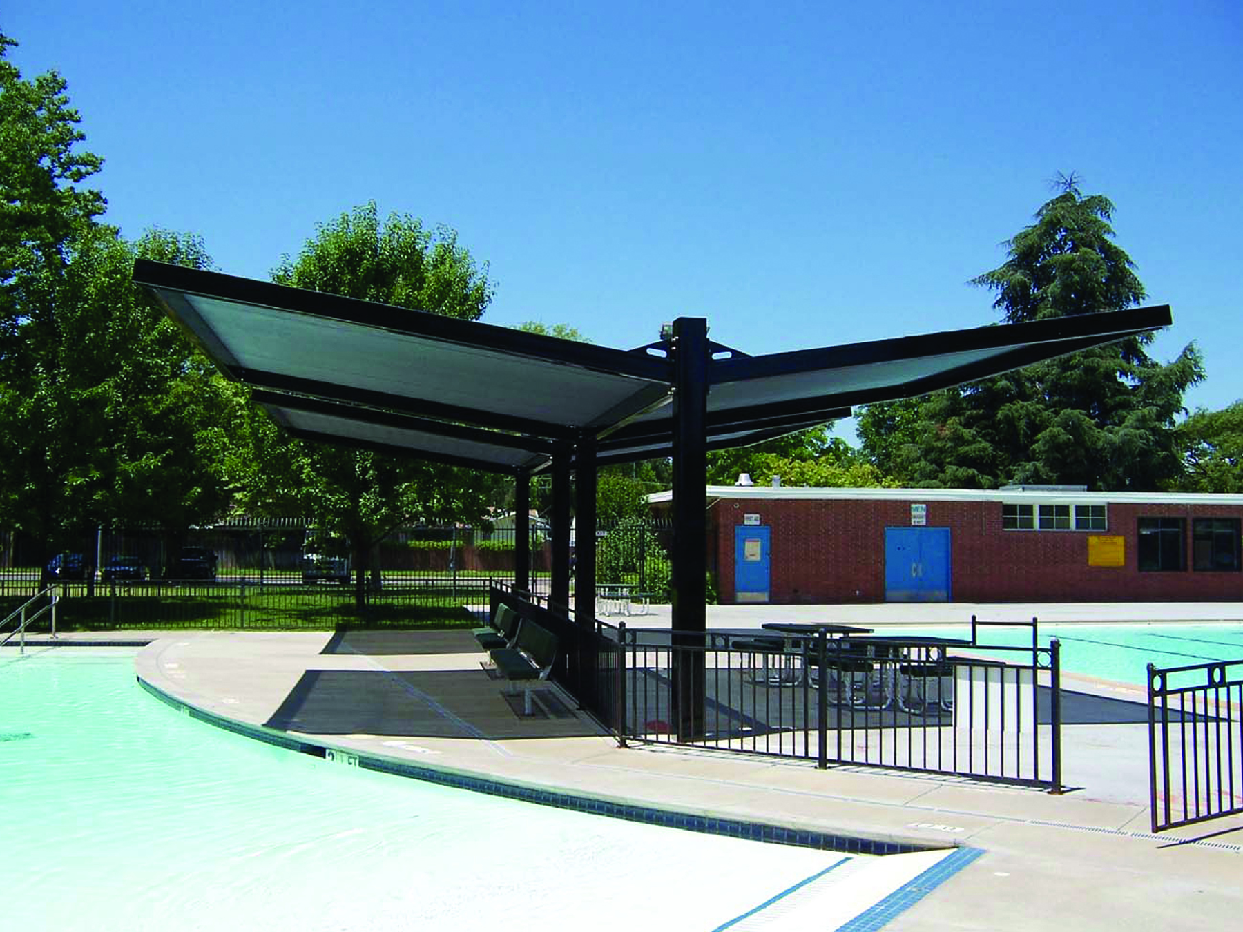 green usa shade structure at outdoor pool