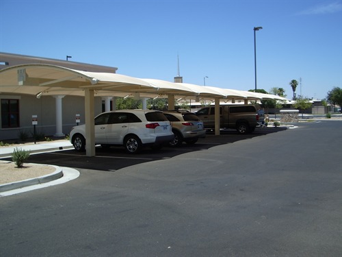 multiple cars parked under usa shades