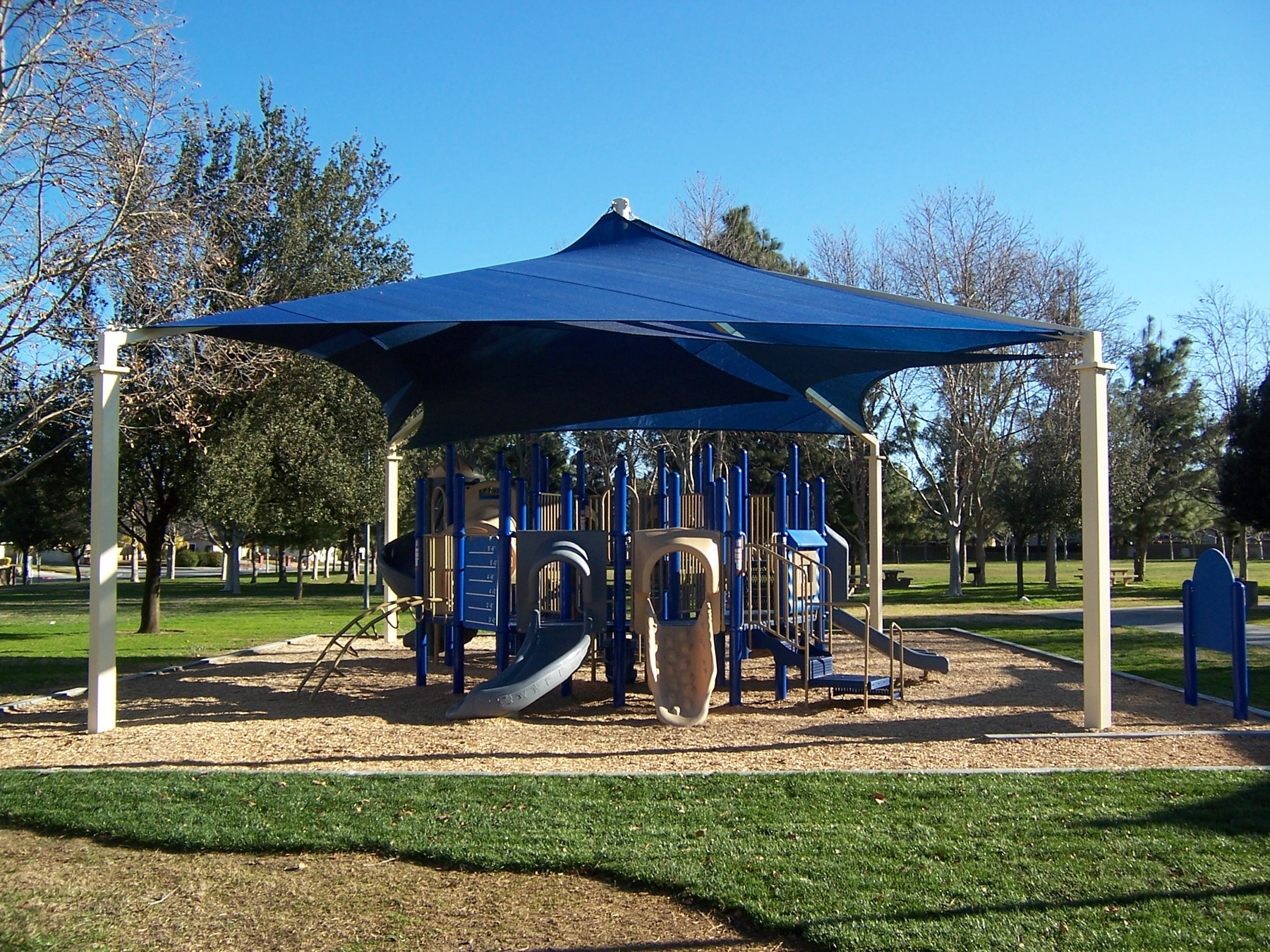 shade structure protecting playground at hasley canyon park