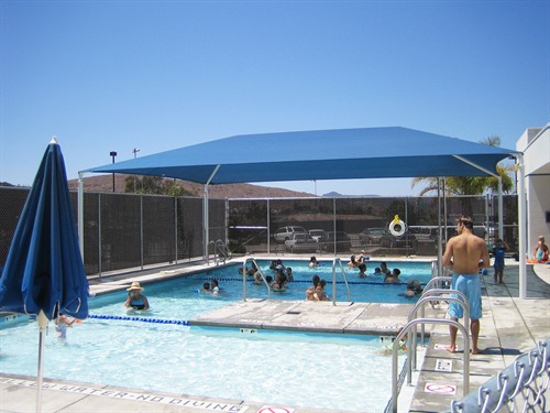 blue usa shade covering people swimming in pool