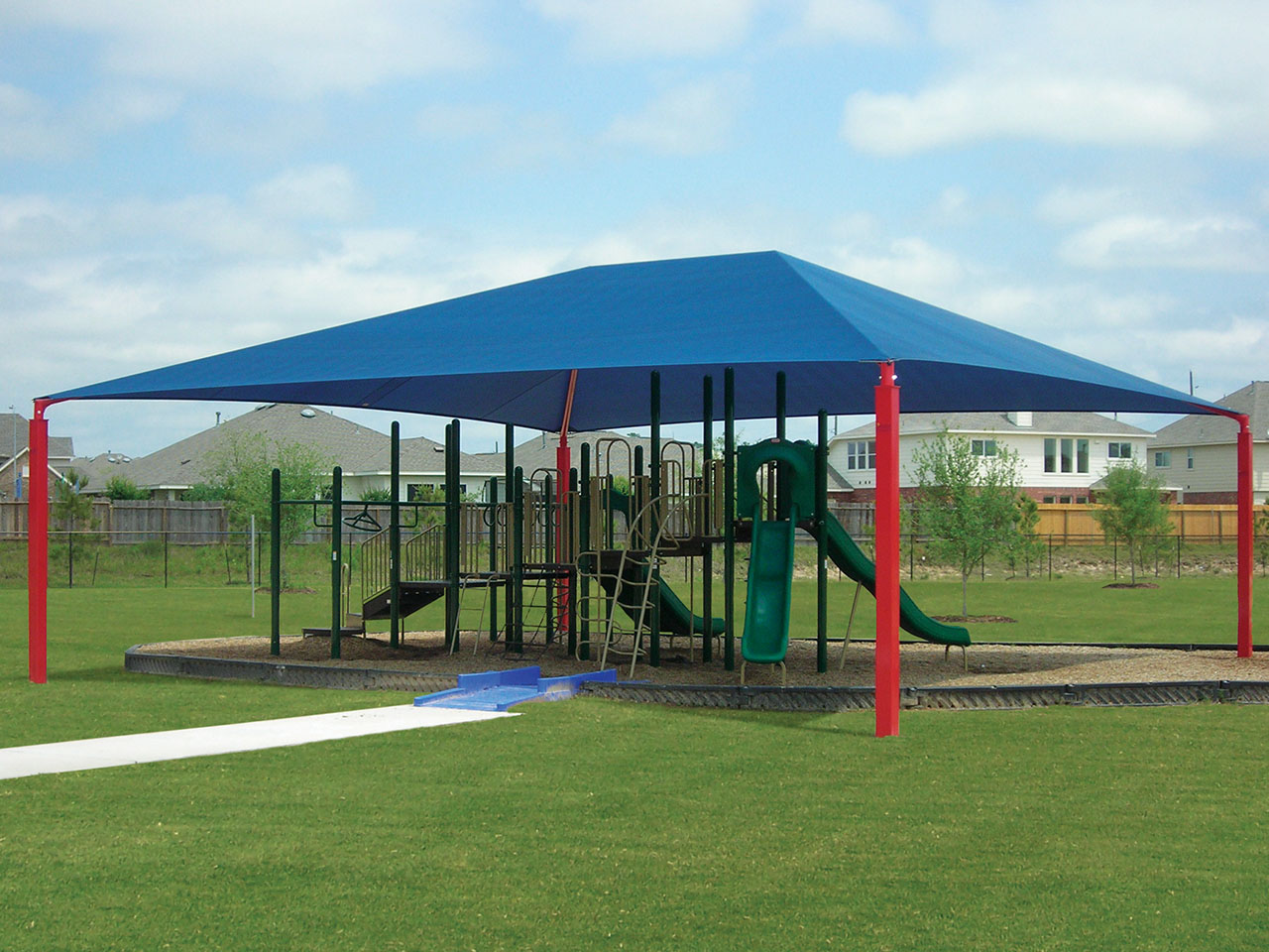 blue shade with red posts covering playground