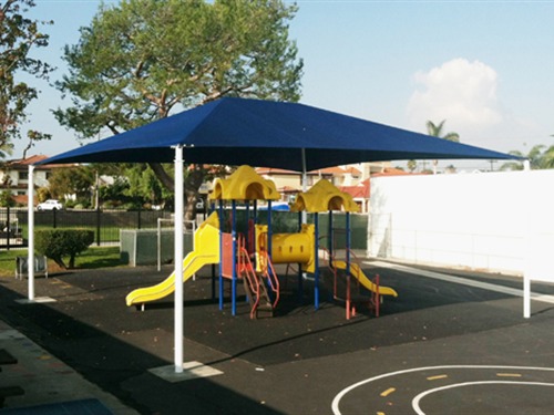 yellow playground under blue usa shade