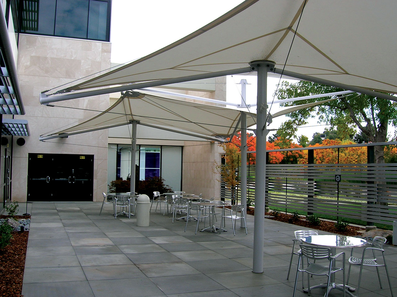 tan shades covering outdoor patio