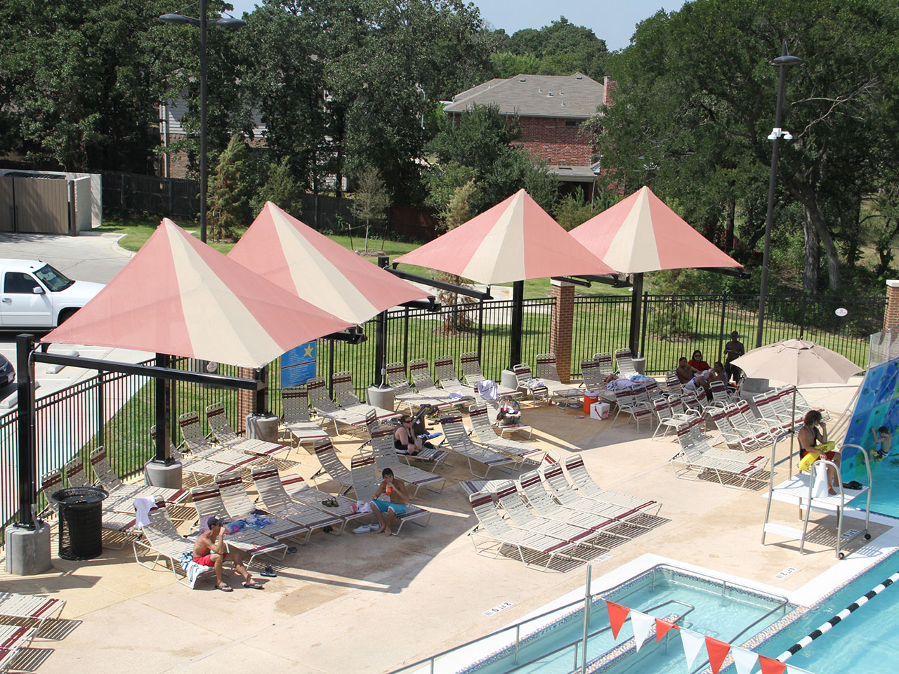 multiple usa shade covering pool lounge chairs