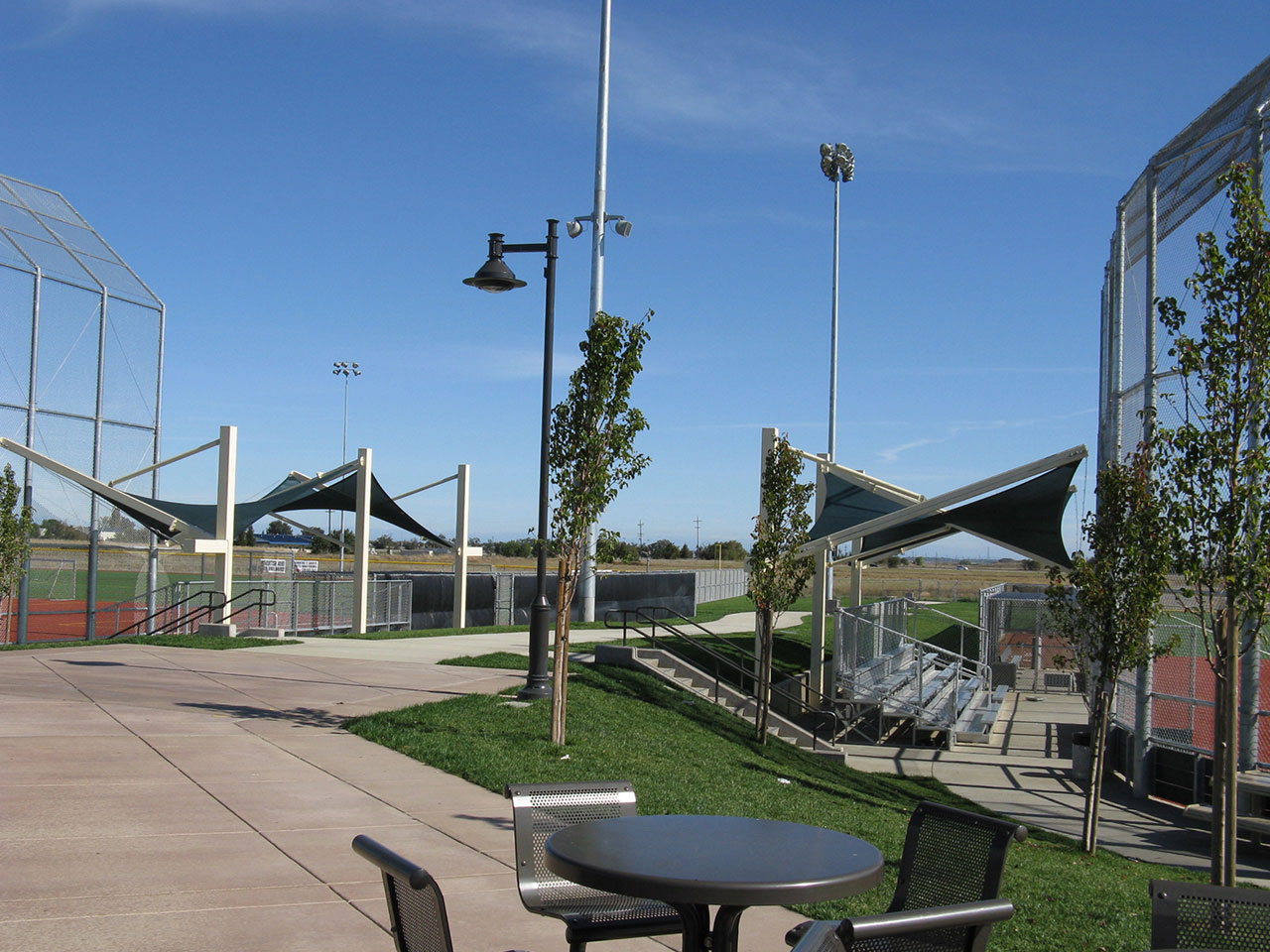 usa shades covering bleachers at baseball field complex