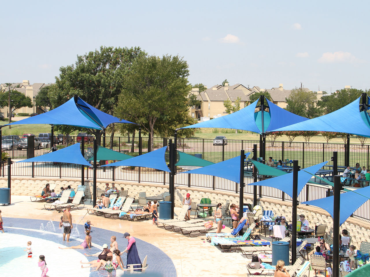 multiple blue usa shades set up over lounge chairs