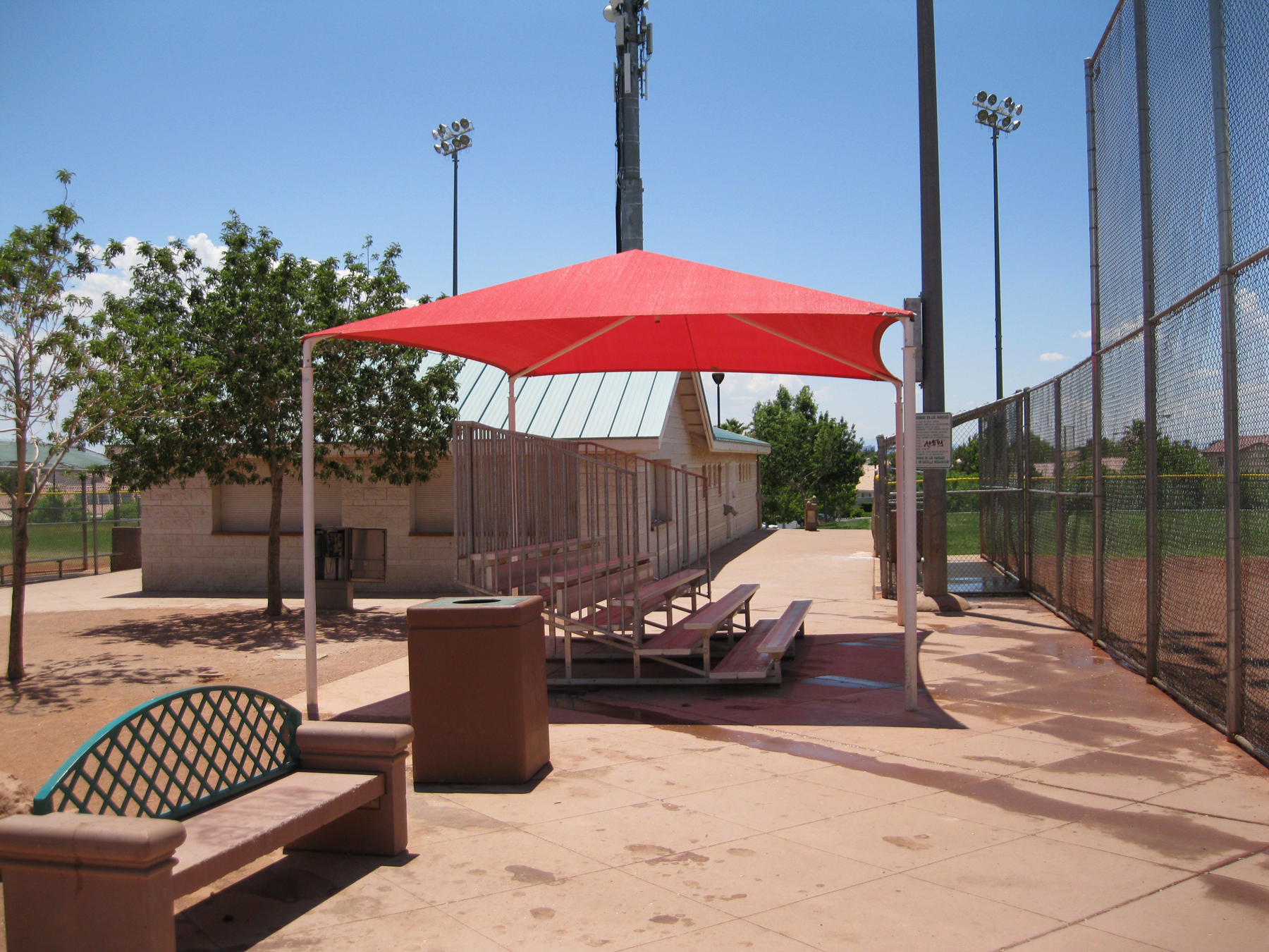 red shade covering bleachers