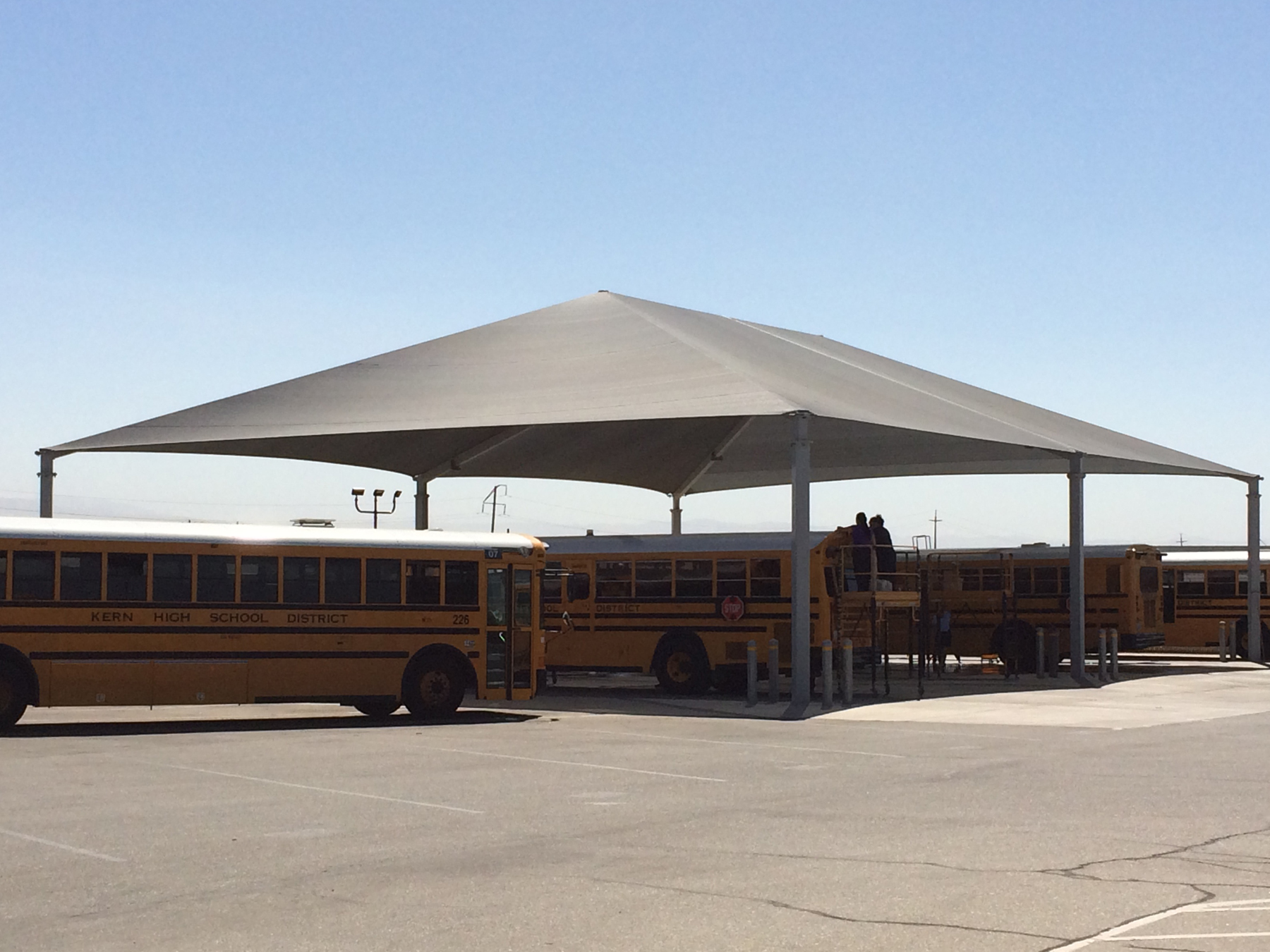 school buses under sun shade