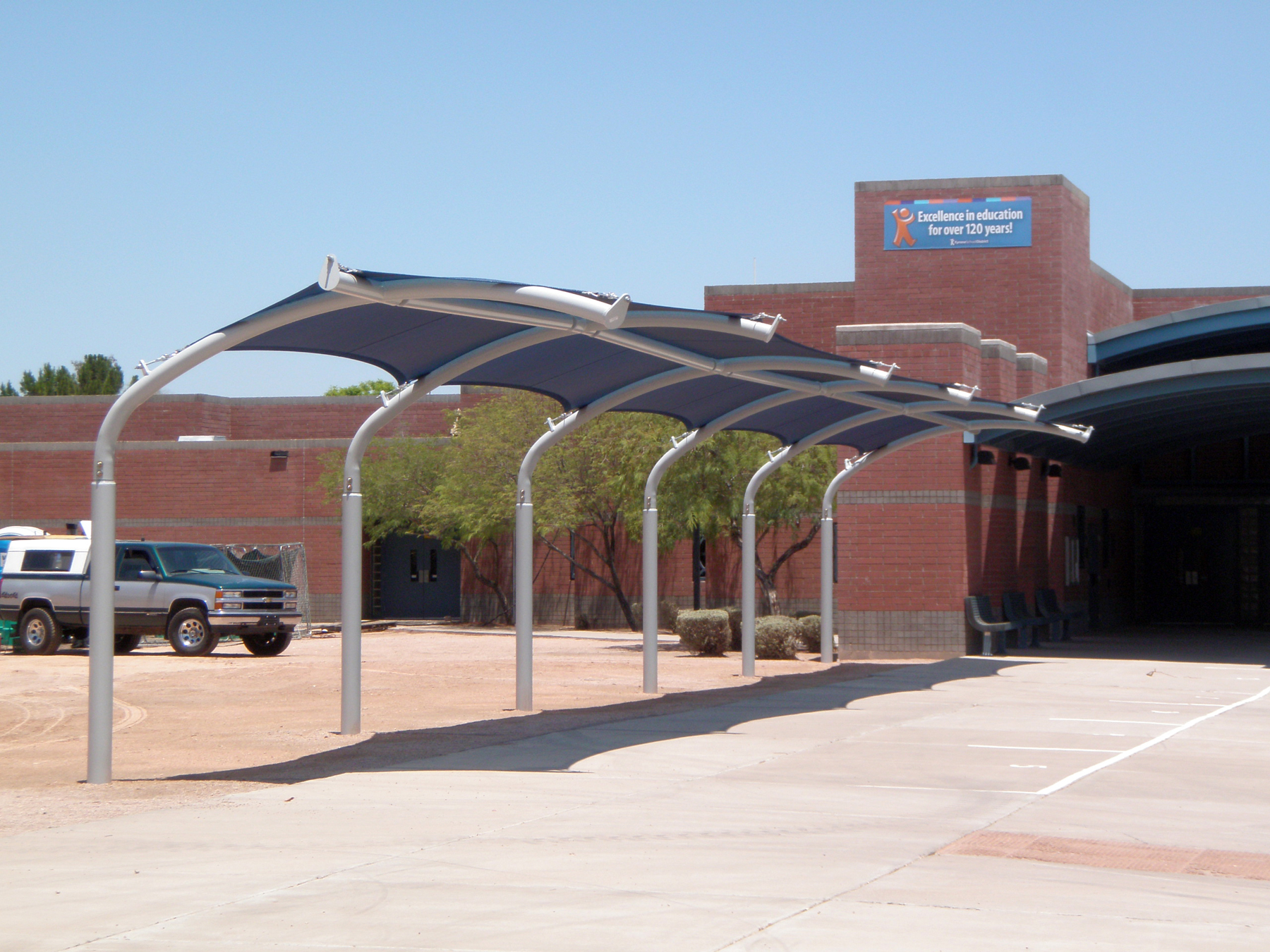 shade structure in front of school entrance