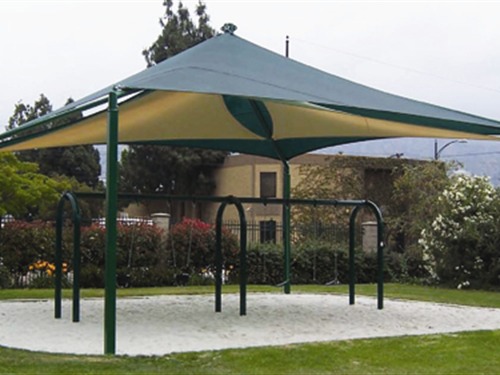 shade structure over swing set at Robert Gross Park