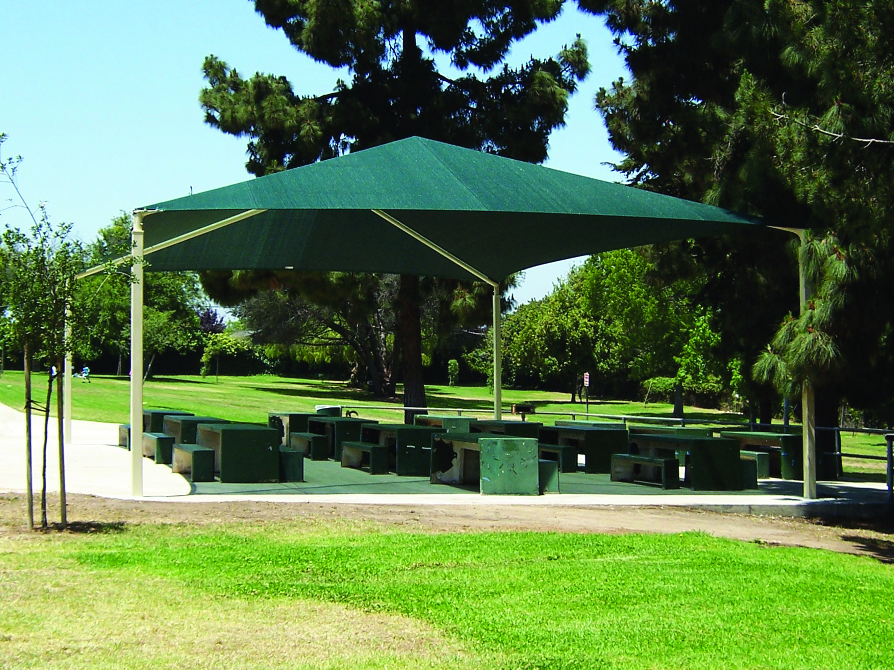 sun shade covering outdoor seating in park