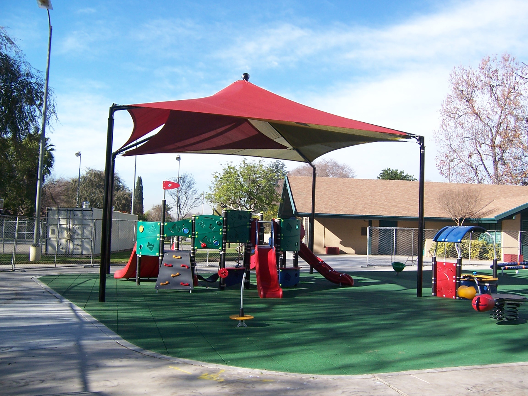 playground equipment covered by shade