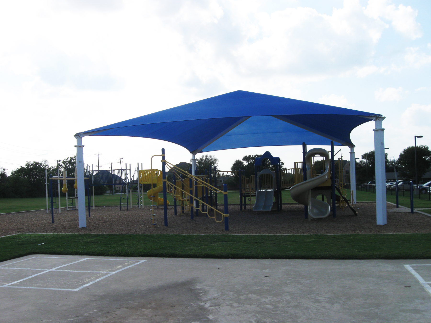 outdoor playground underneath blue usa shade