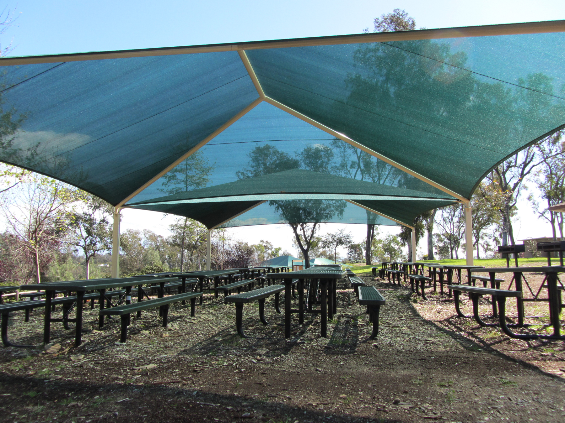 usa shade covering multiple outdoor picnic tables